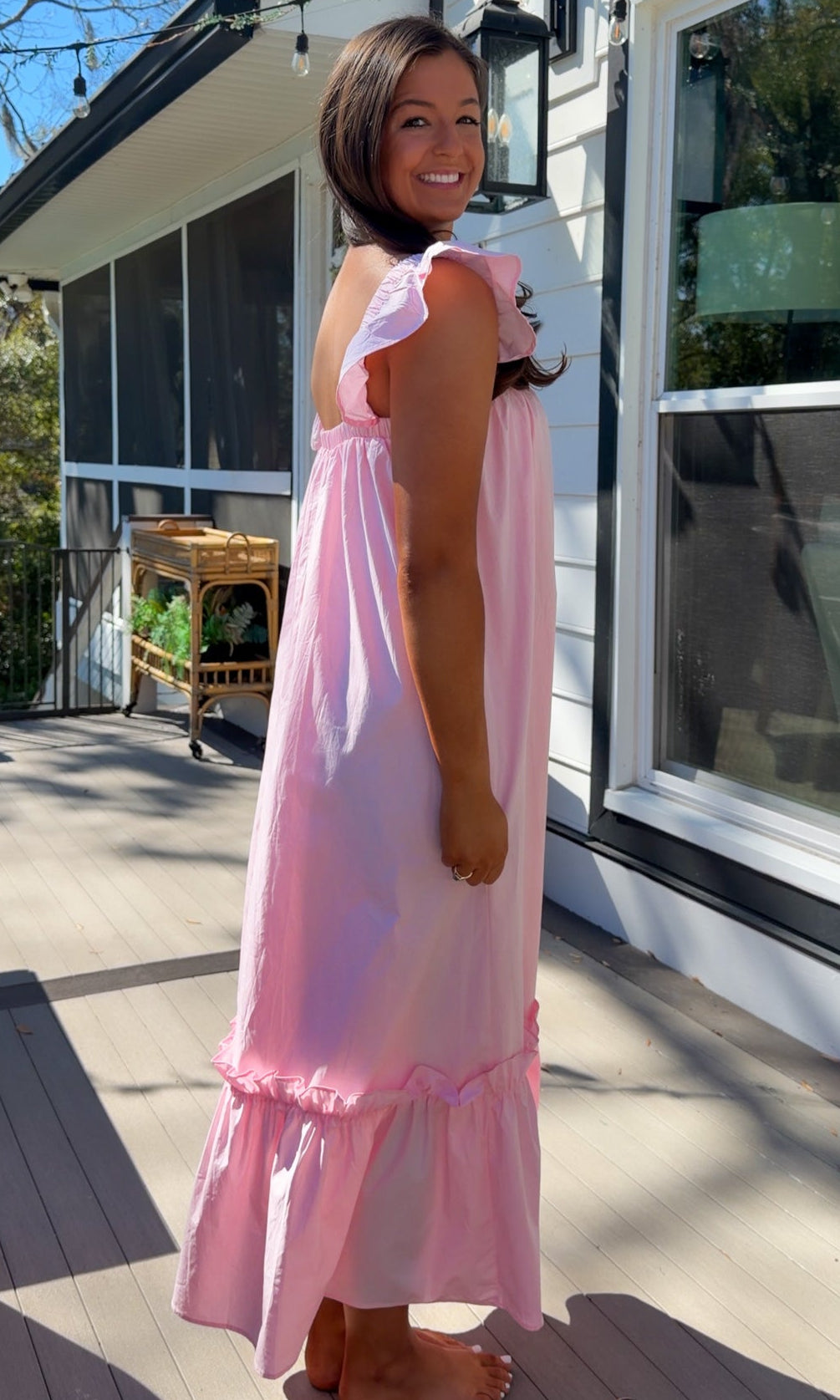 baby pink midi dress with flutter sleeves and tiered ruffle hem