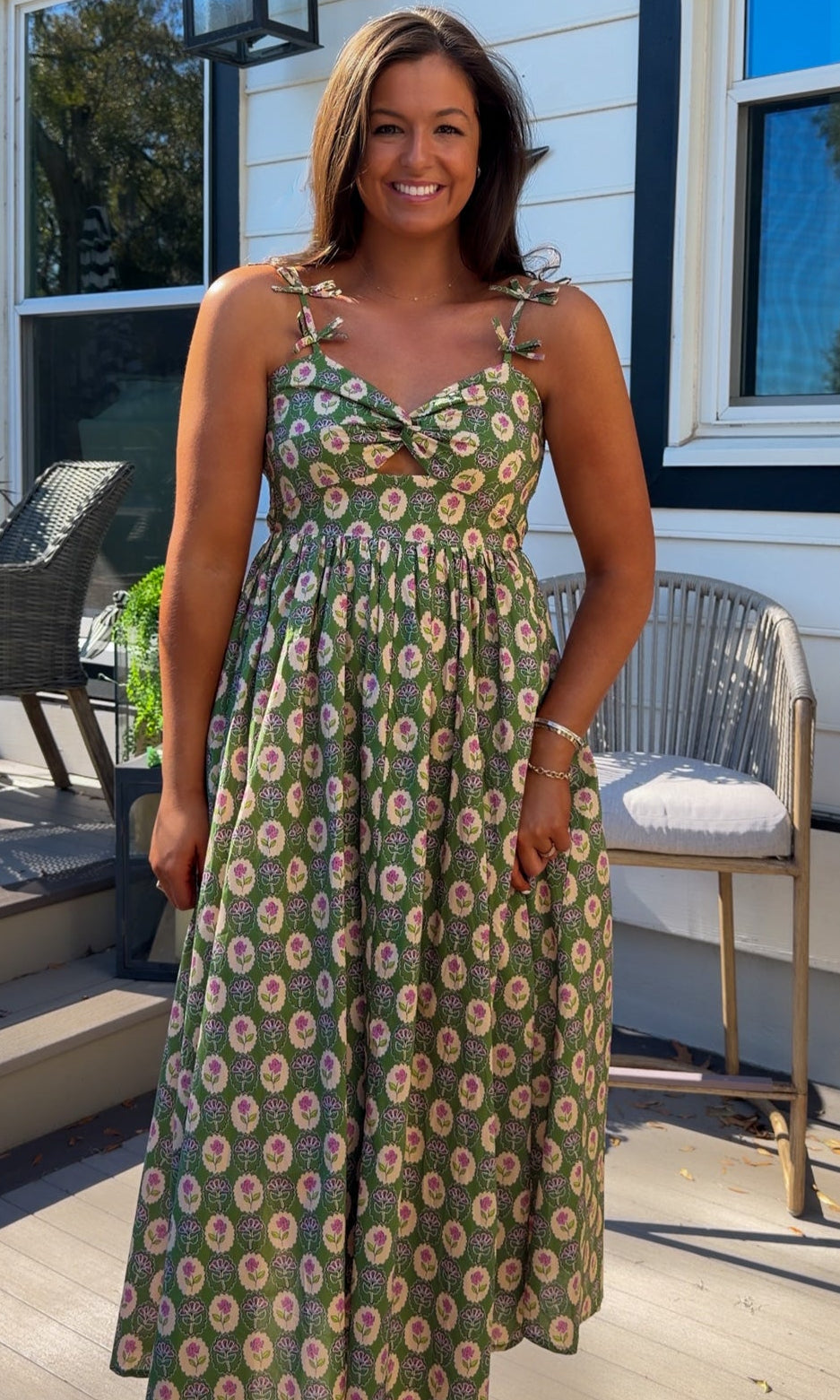 green floral sweetheart neckline midi dress with bow straps and chest cutout