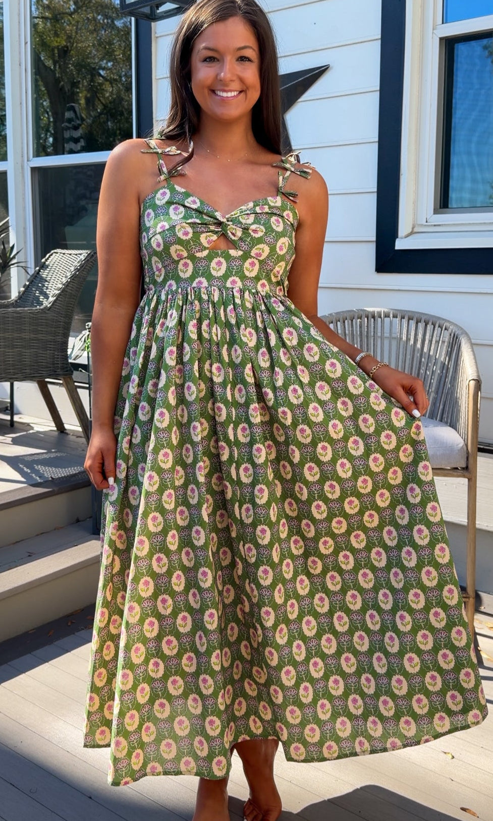 green floral sweetheart neckline midi dress with bow straps and chest cutout