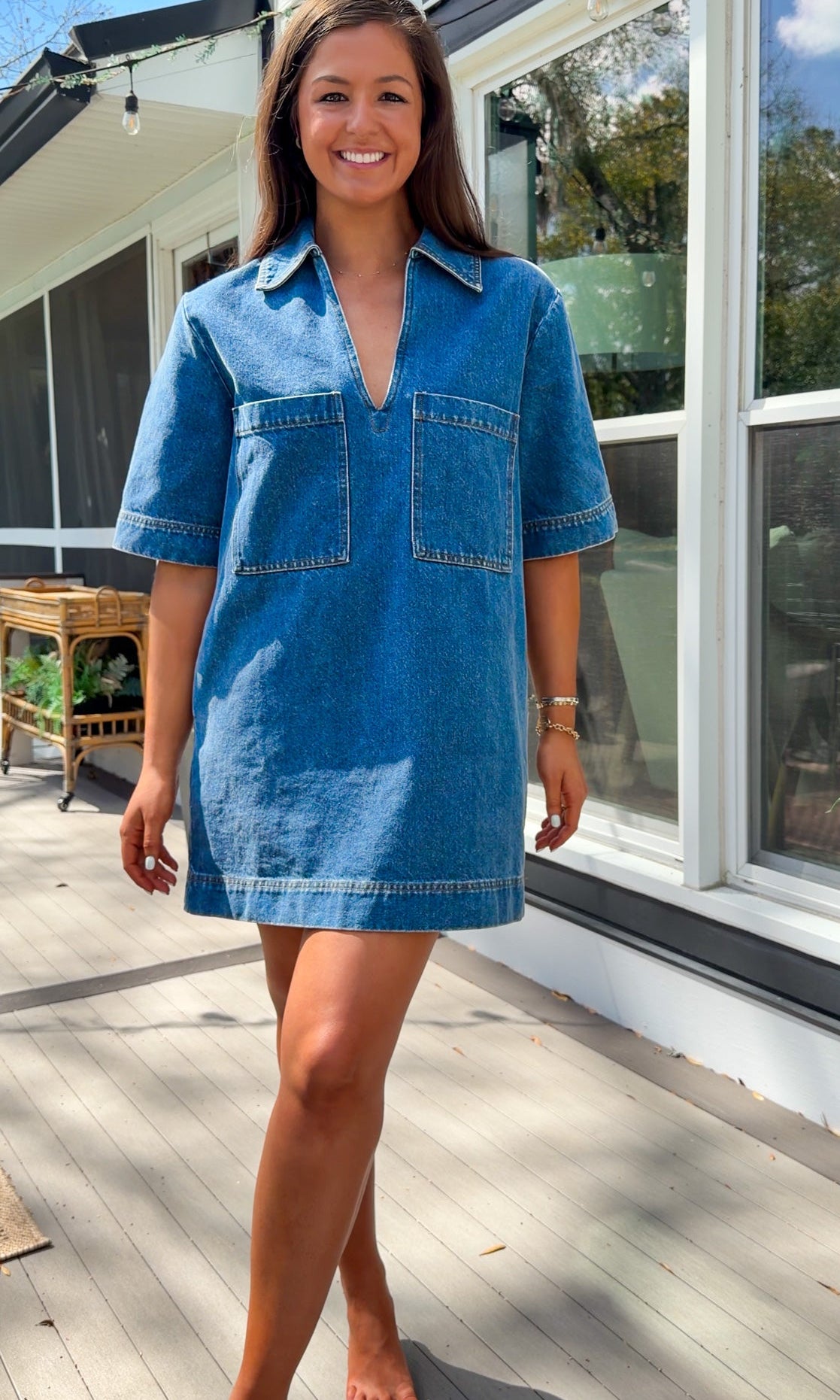 oversized denim mini dress with collar v neckline half sleeves and front patch pockets