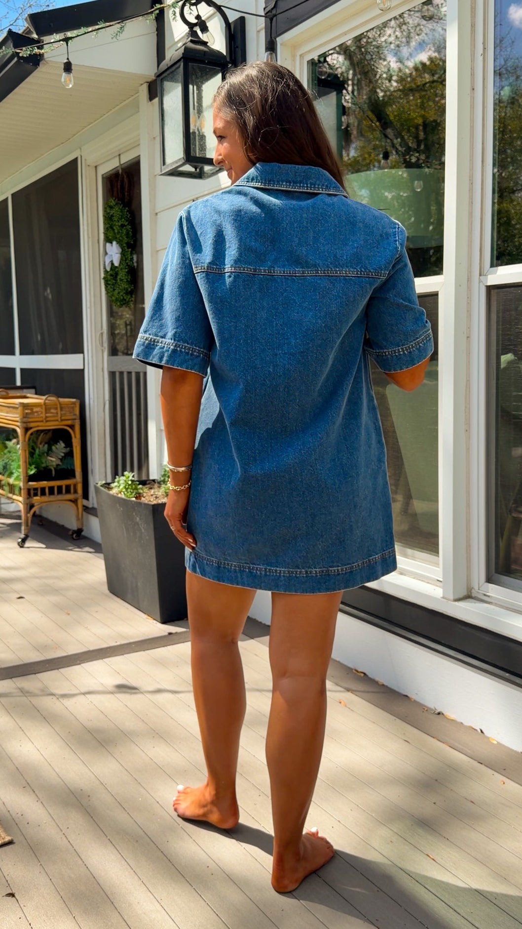 oversized denim mini dress with collar v neckline half sleeves and front patch pockets