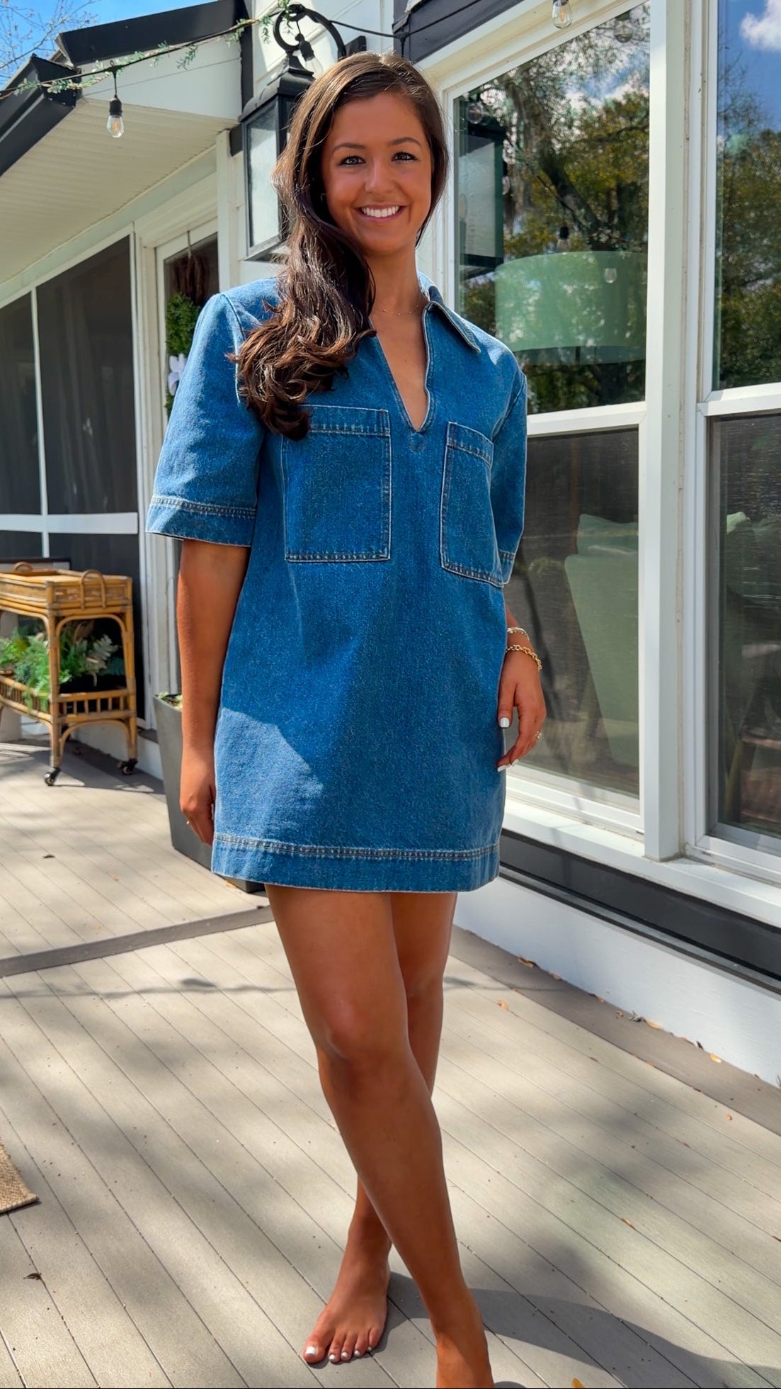 oversized denim mini dress with collar v neckline half sleeves and front patch pockets
