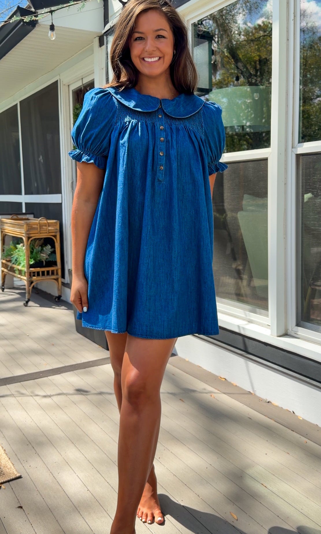 denim mini dress with peter pan collar puff sleeves button front and smocked back detail