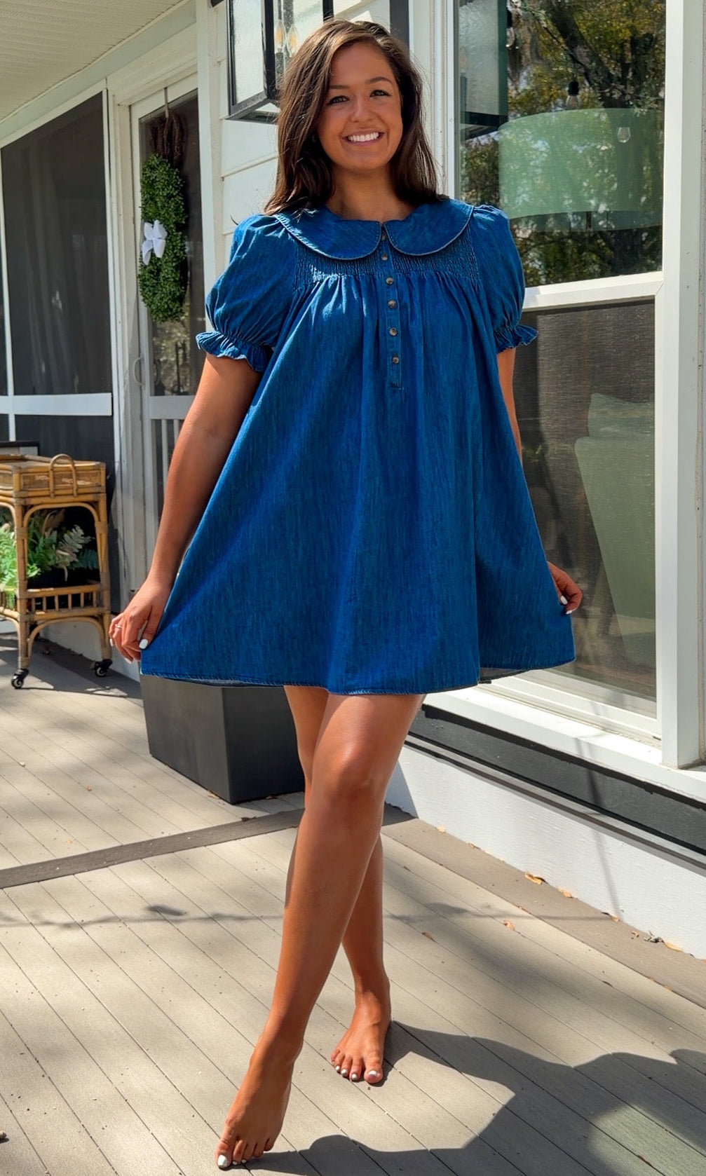 denim mini dress with peter pan collar puff sleeves button front and smocked back detail