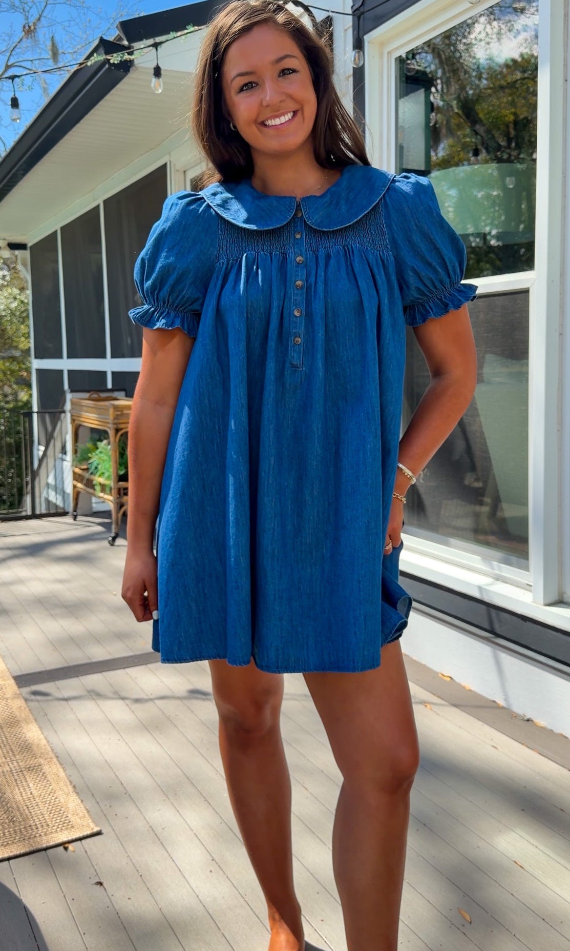 denim mini dress with peter pan collar puff sleeves button front and smocked back detail