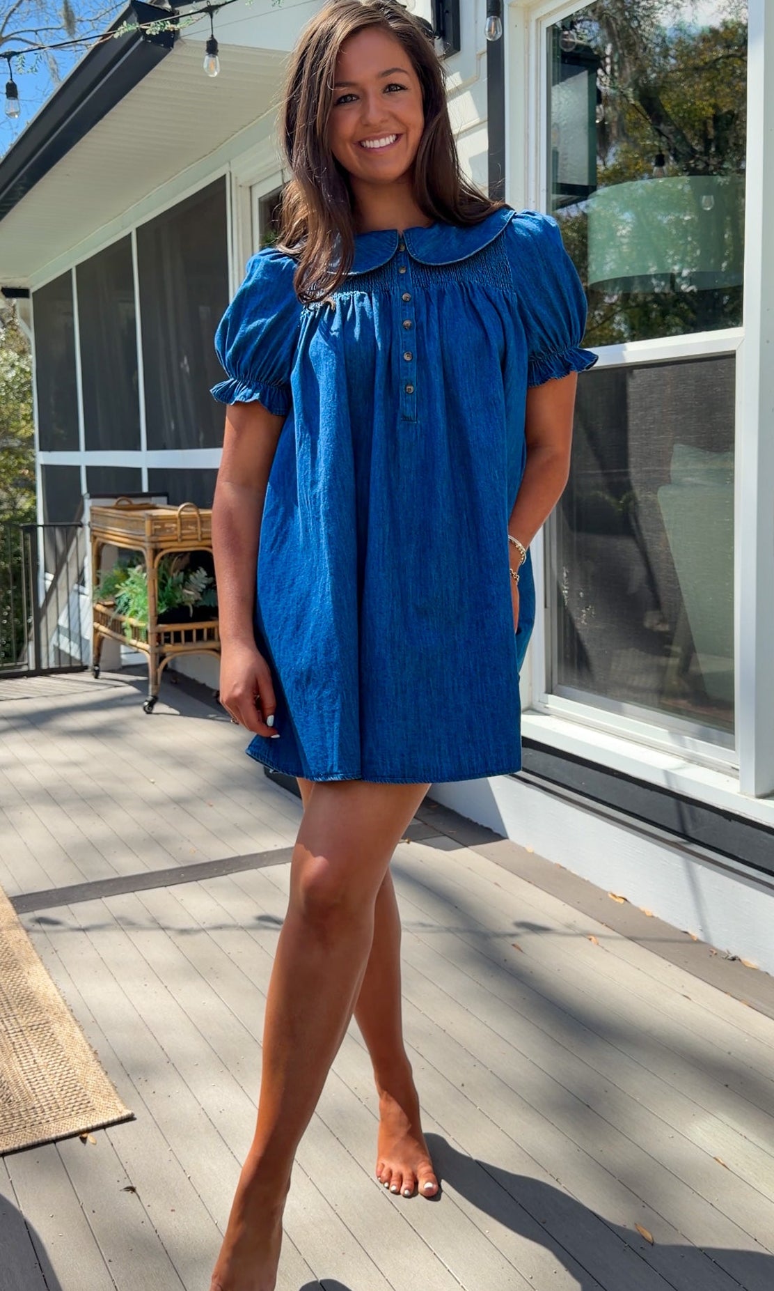 denim mini dress with peter pan collar puff sleeves button front and smocked back detail