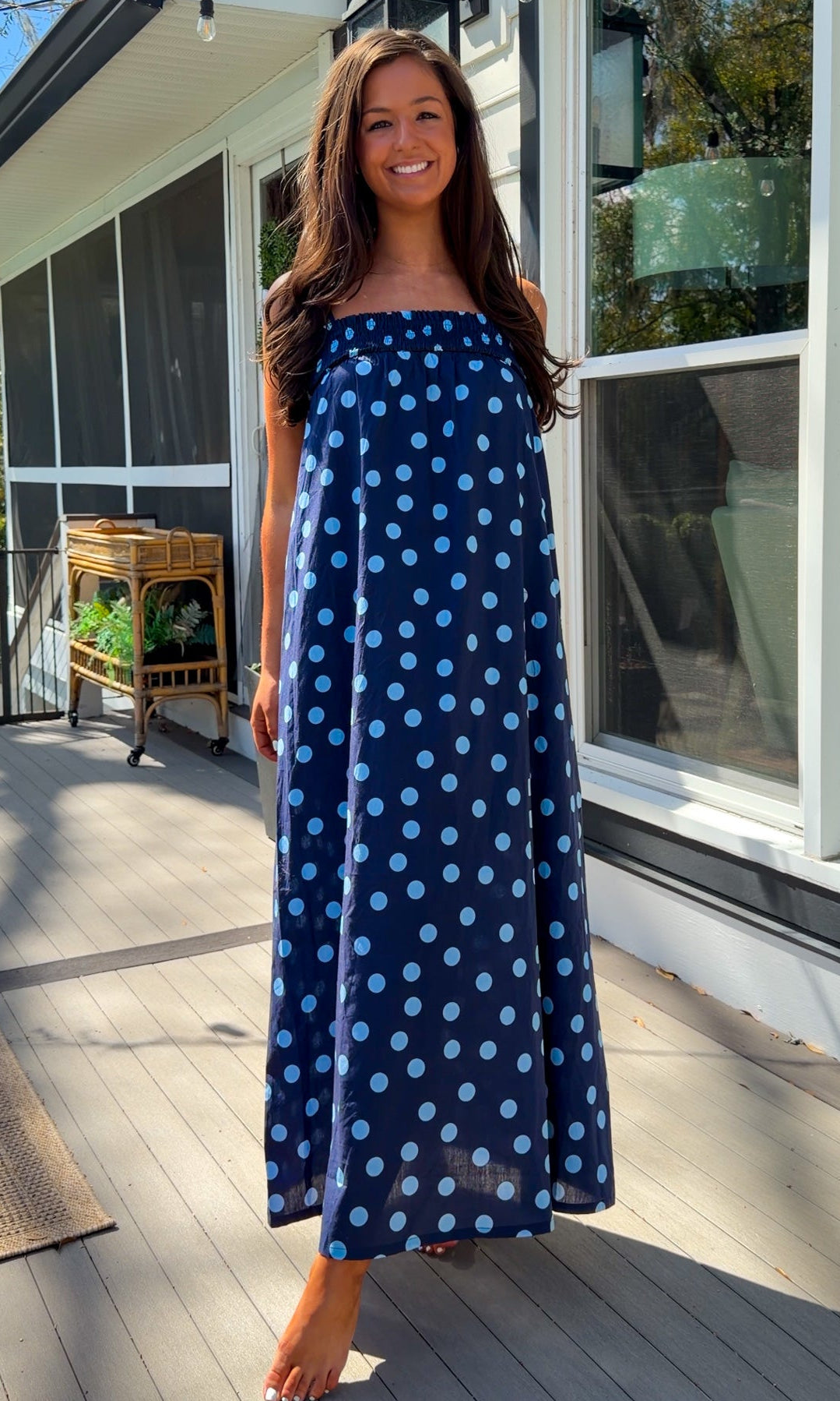 midnight blue polka dot maxi dress with smocked bodice and adjustable spaghetti straps