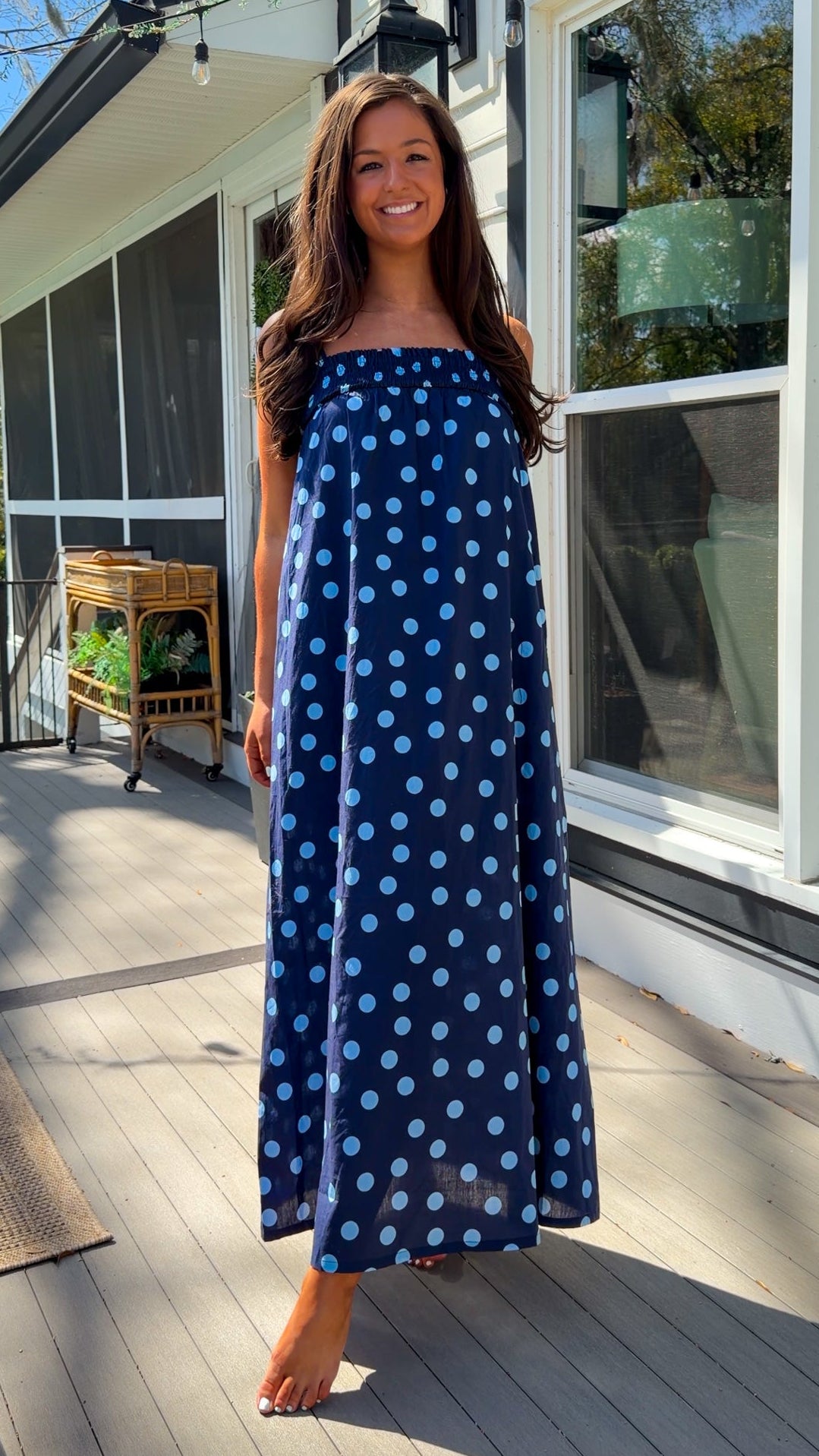 midnight blue polka dot maxi dress with smocked bodice and adjustable spaghetti straps