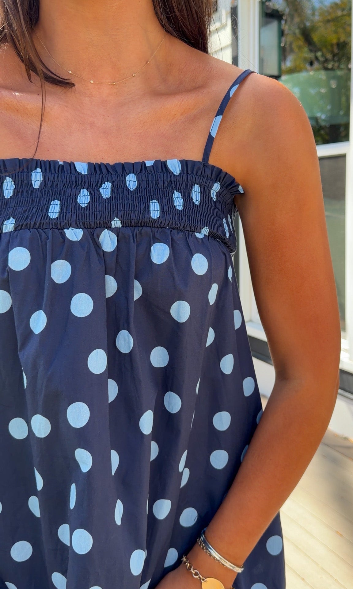 midnight blue polka dot maxi dress with smocked bodice and adjustable spaghetti straps