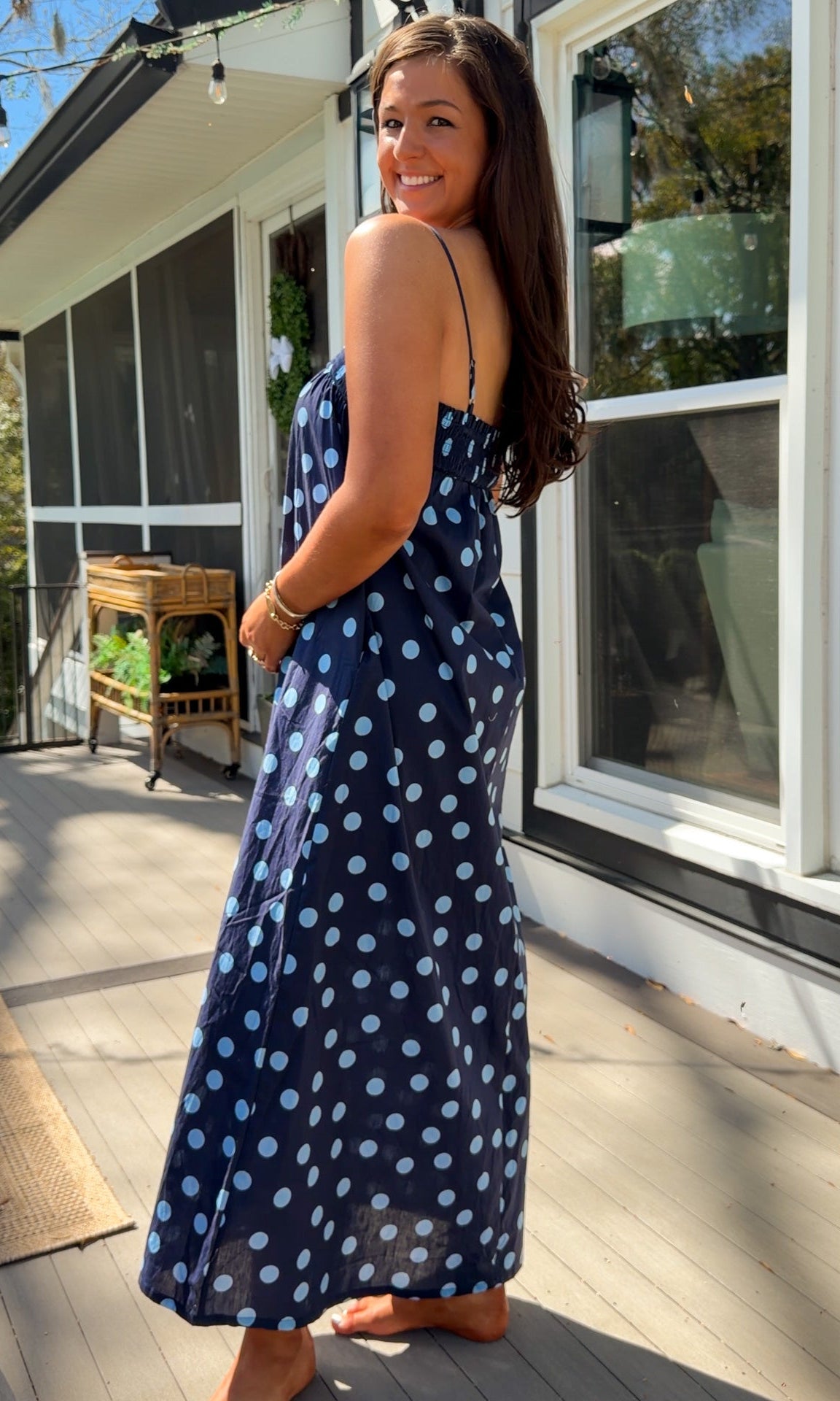 midnight blue polka dot maxi dress with smocked bodice and adjustable spaghetti straps