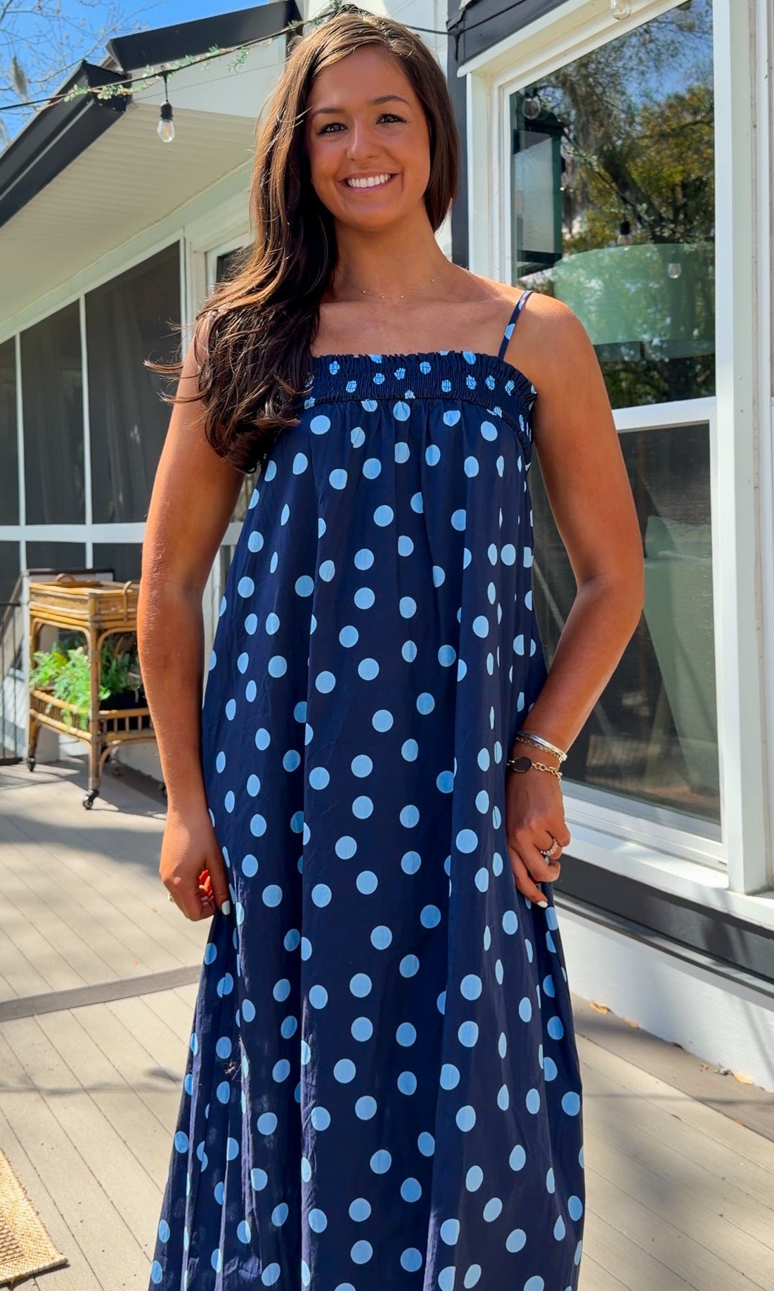 midnight blue polka dot maxi dress with smocked bodice and adjustable spaghetti straps