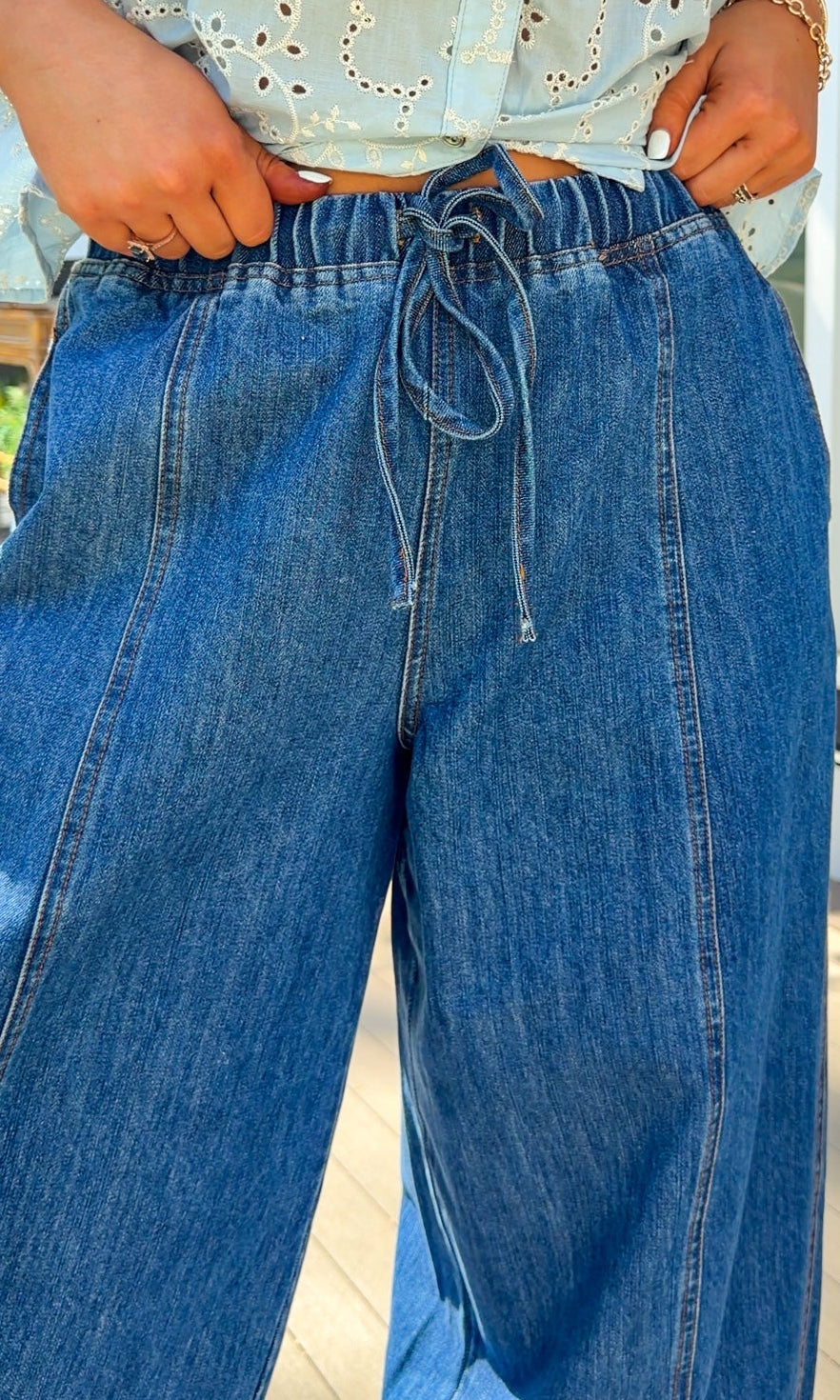 wide leg barrel denim pants with elastic drawstring waistband and front seam detail in medium wash