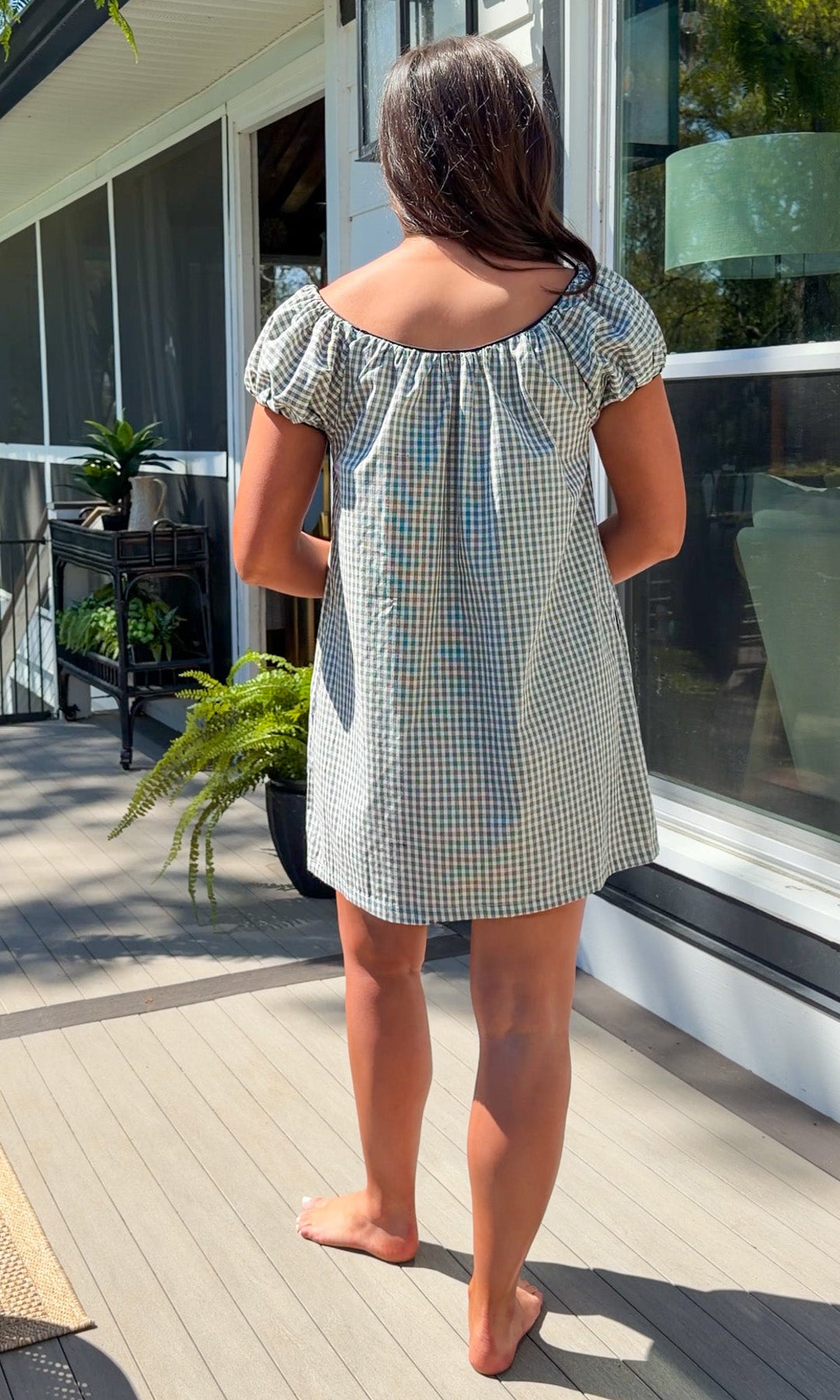 black and white gingham mini dress with cap sleeves and bow