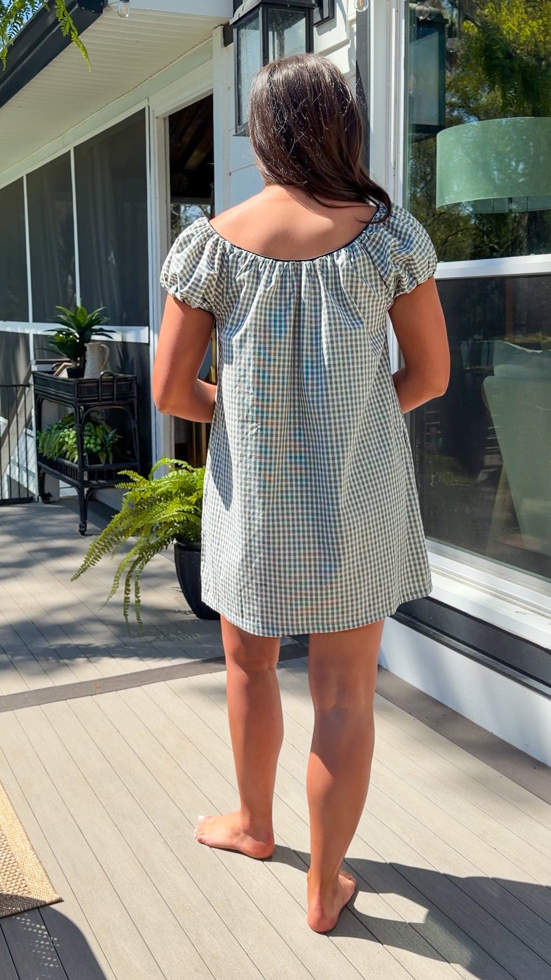 black and white gingham mini dress with cap sleeves and bow