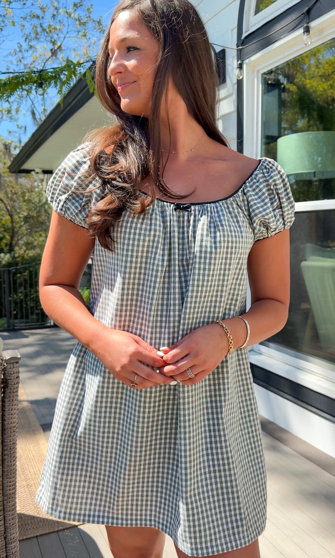 black and white gingham mini dress with cap sleeves and bow