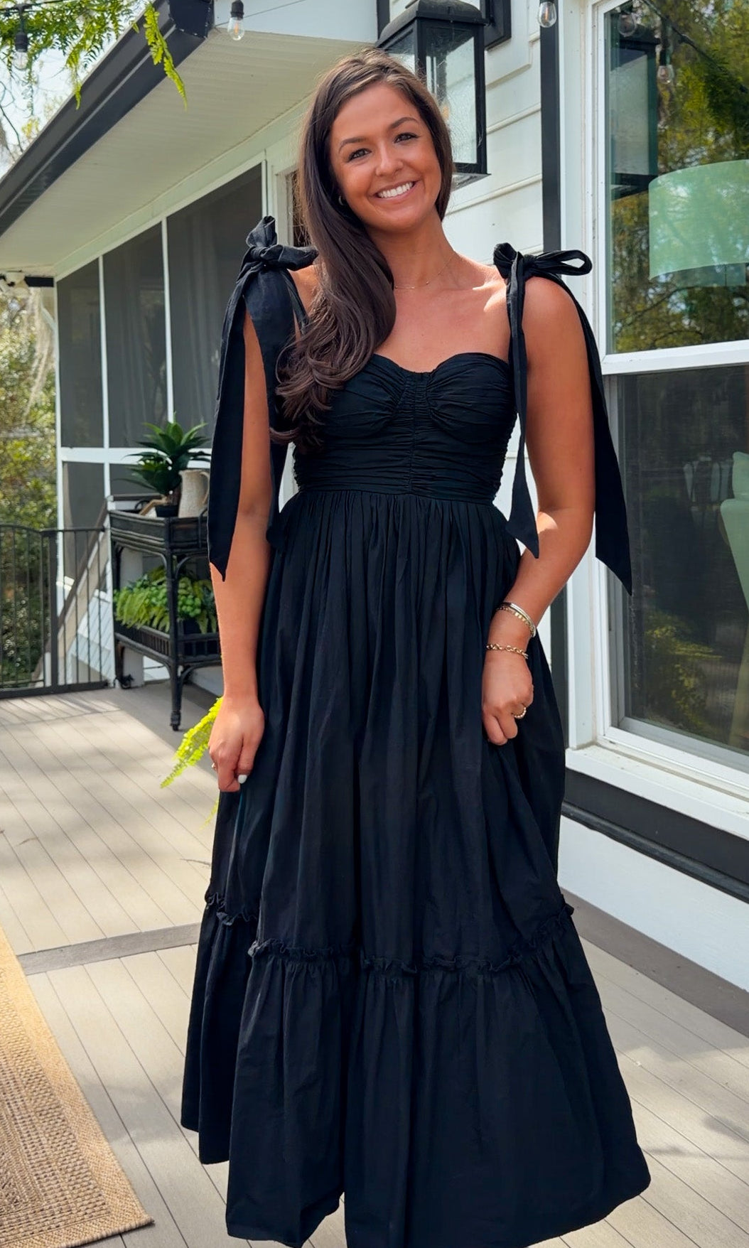 black midi dress with ruched bust tie straps smocked back and tiered skirt