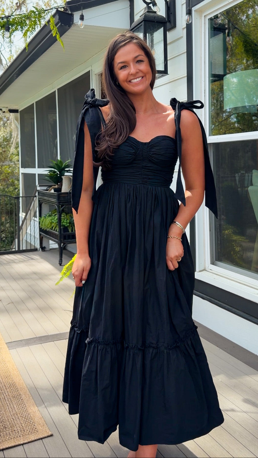 black midi dress with ruched bust tie straps smocked back and tiered skirt