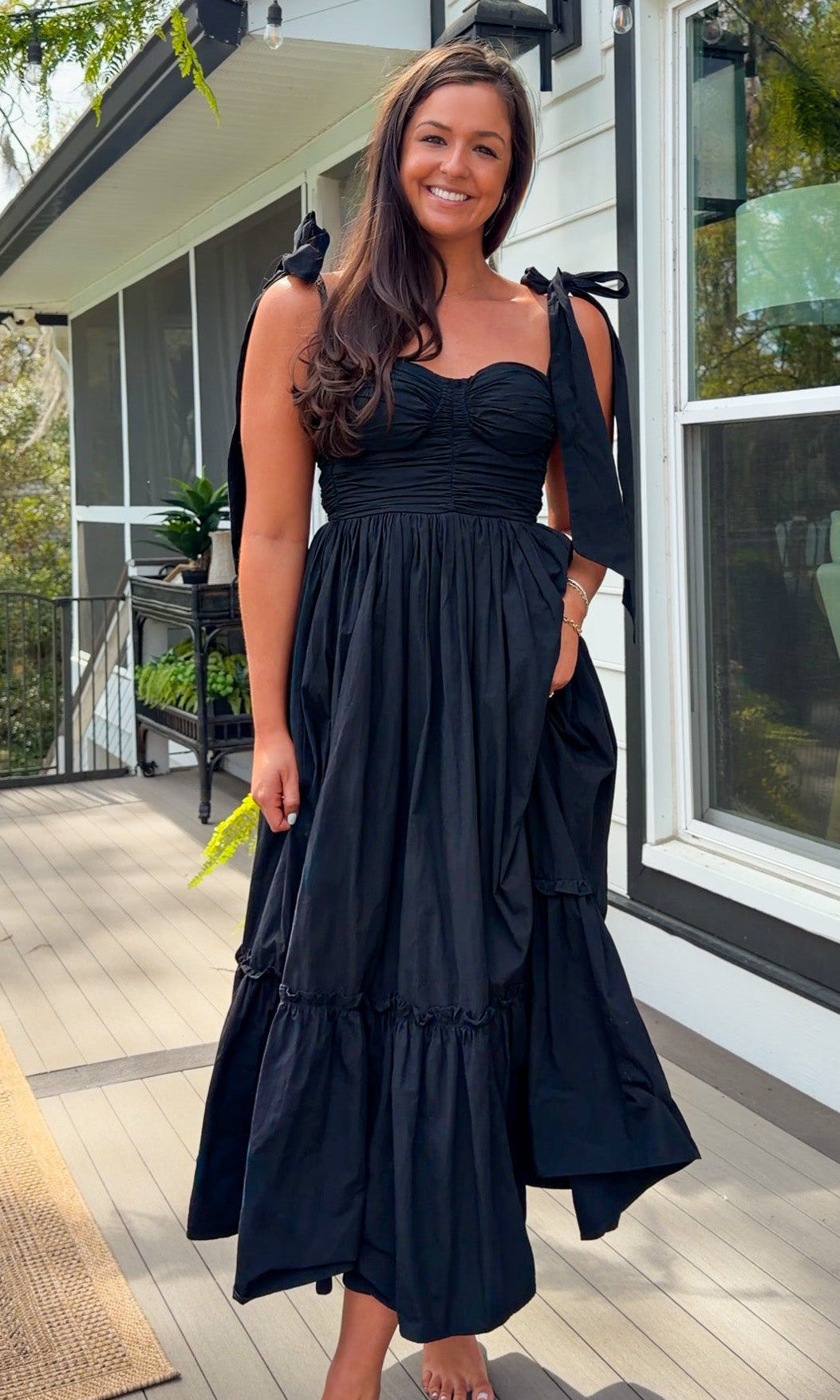 black midi dress with ruched bust tie straps smocked back and tiered skirt