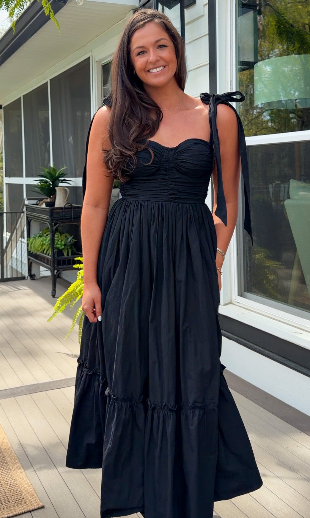 black midi dress with ruched bust tie straps smocked back and tiered skirt