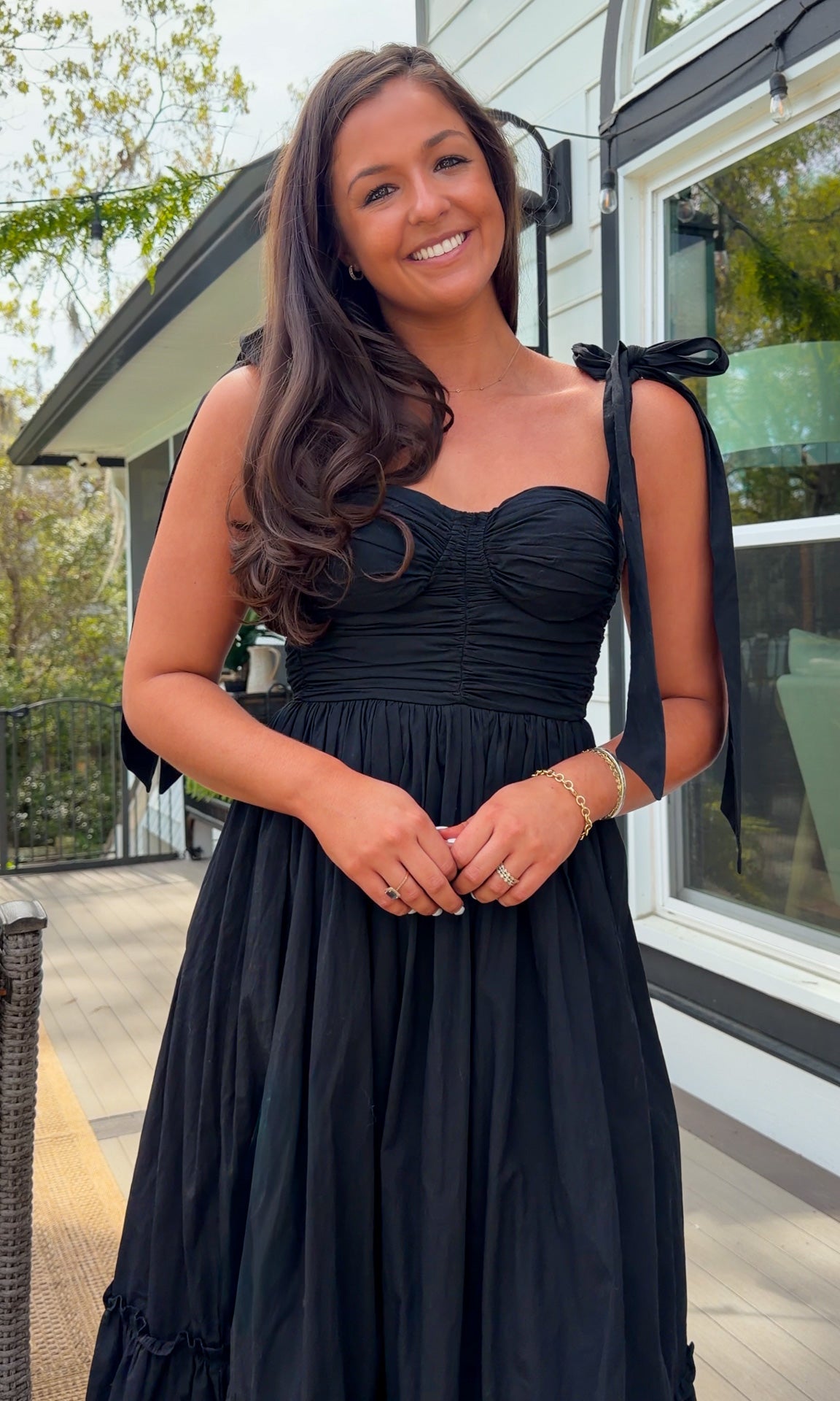 black midi dress with ruched bust tie straps smocked back and tiered skirt