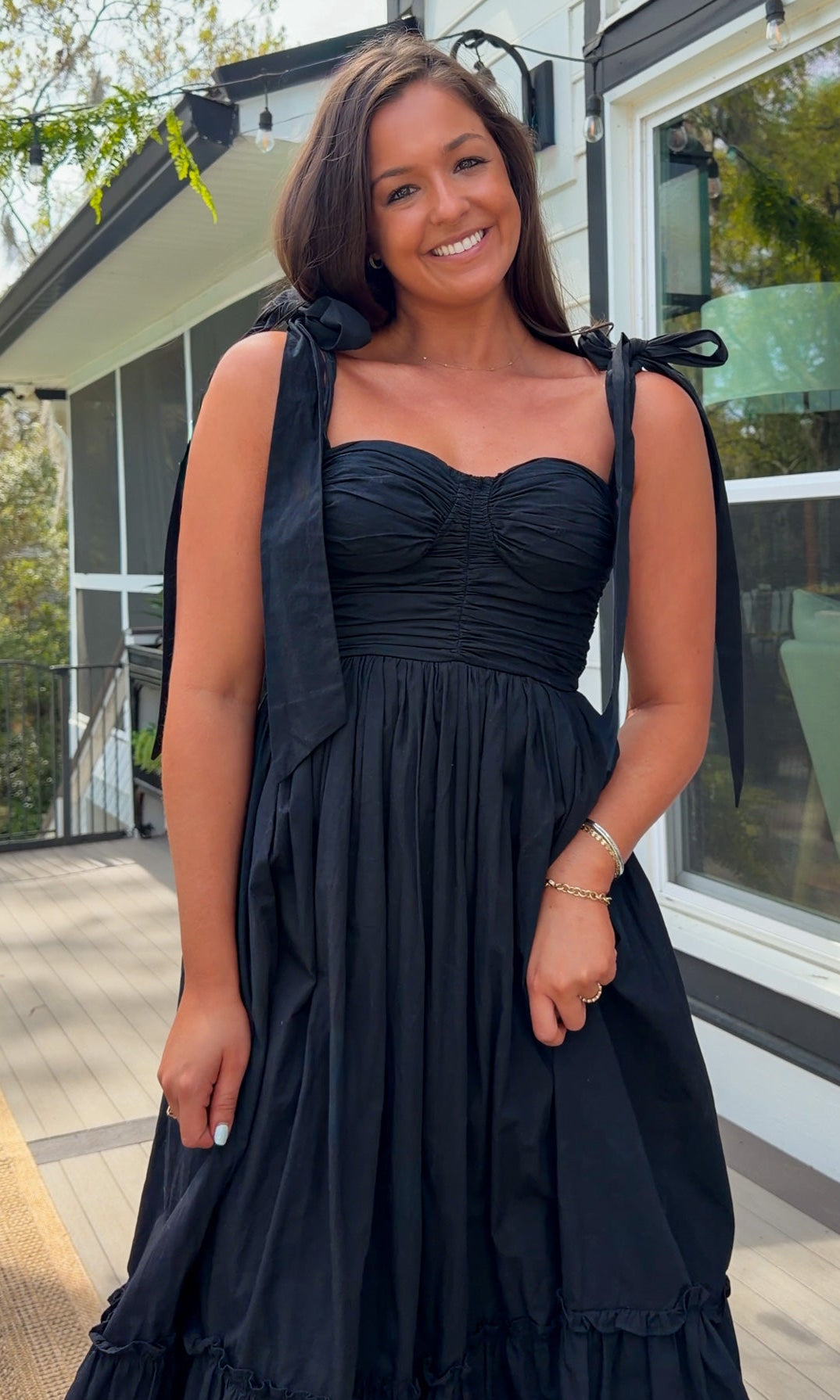 black midi dress with ruched bust tie straps smocked back and tiered skirt