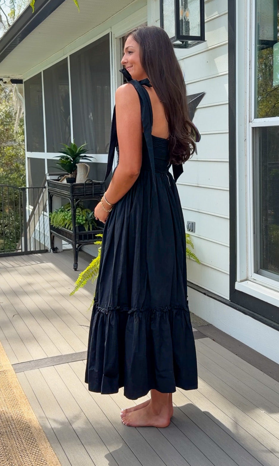 black midi dress with ruched bust tie straps smocked back and tiered skirt