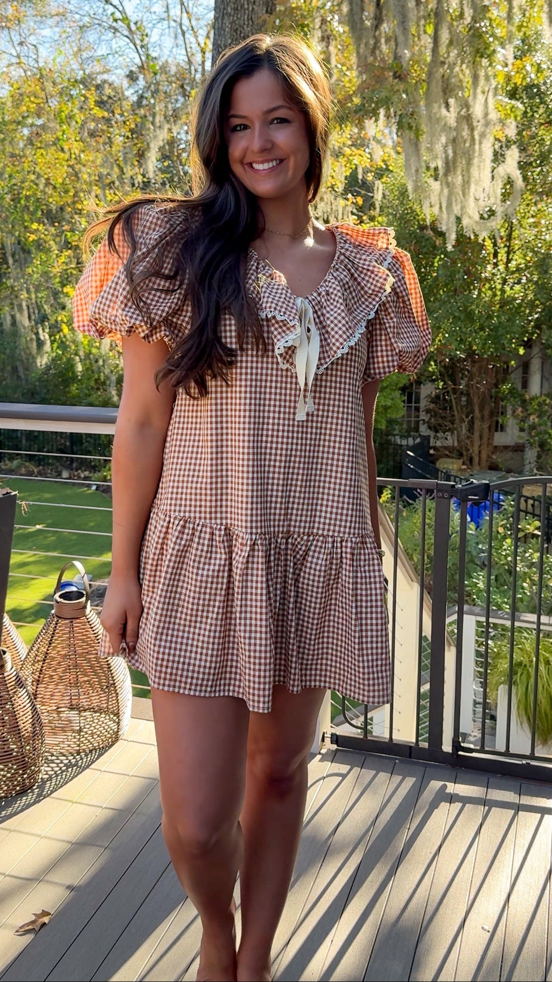 gingham orange and brown mini dress with ruffle collar and lace trim front far view