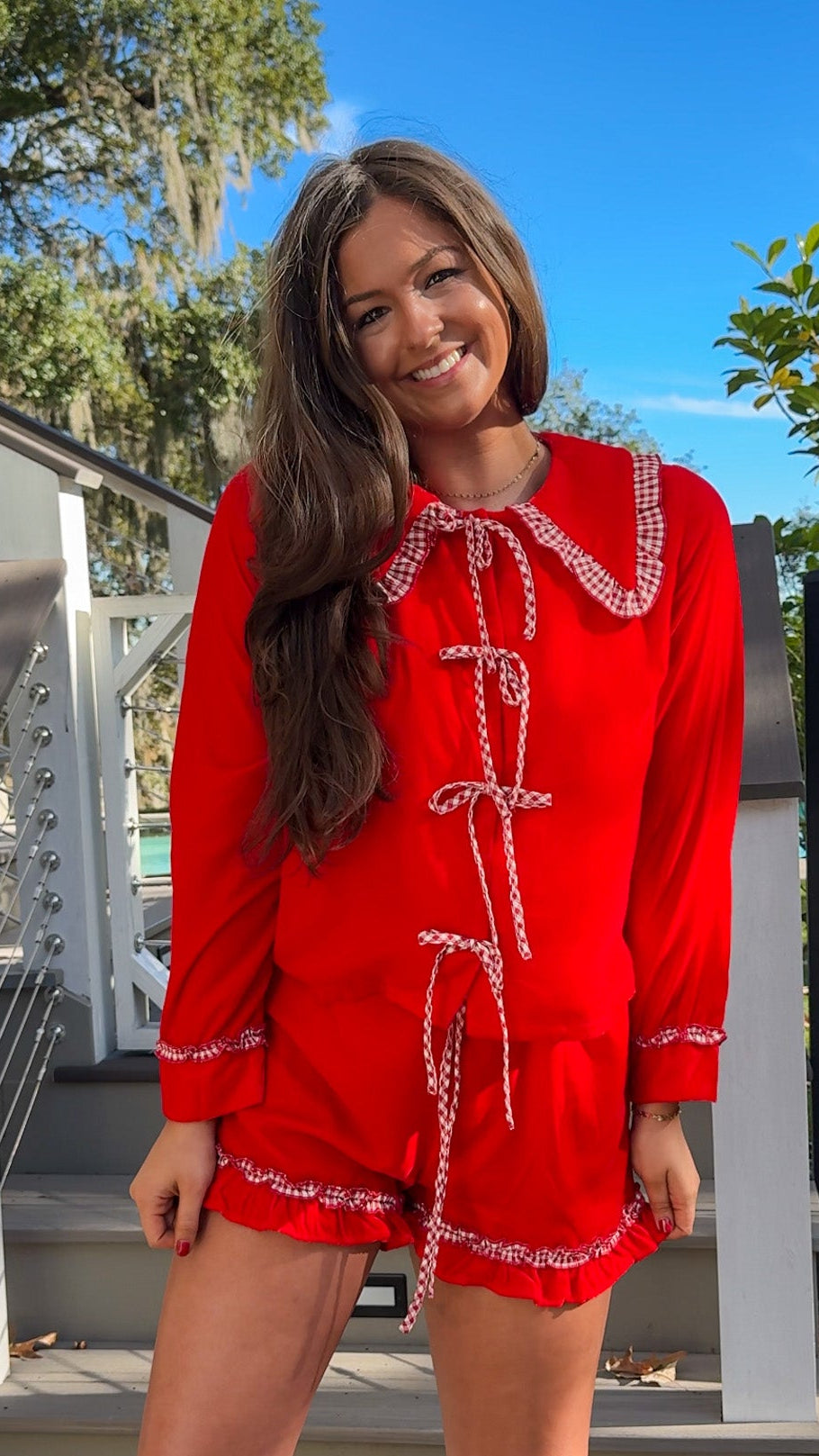 red velvet long sleeve top and short pajama set with gingham oversized peter pan collar and ruffle trim on shorts christmas pajamas bows 1