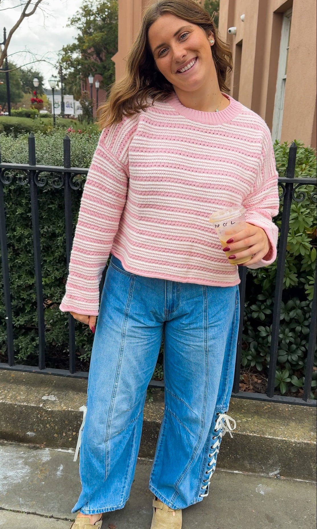 denim barrel jeans lace up side detail and pink and white sweater top