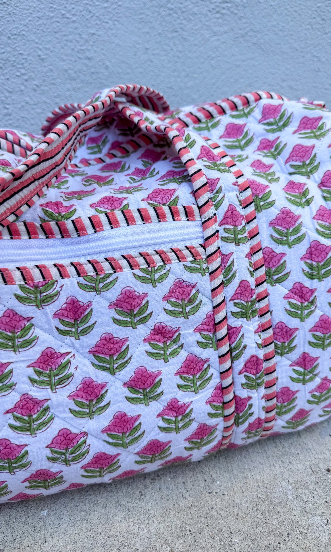 Floral patterned fabric on a flat surface with a light blue background