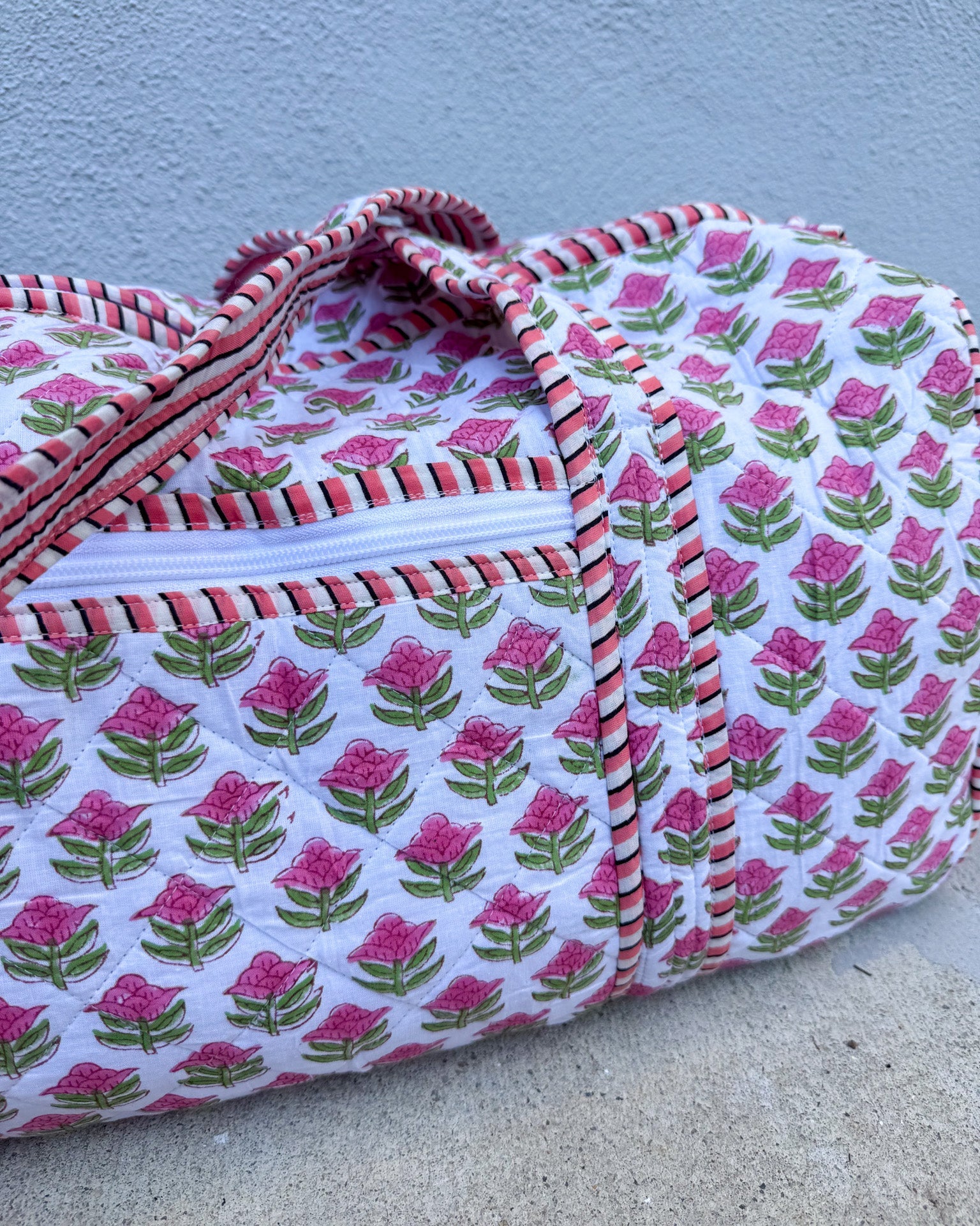 Floral patterned fabric on a flat surface with a light blue background