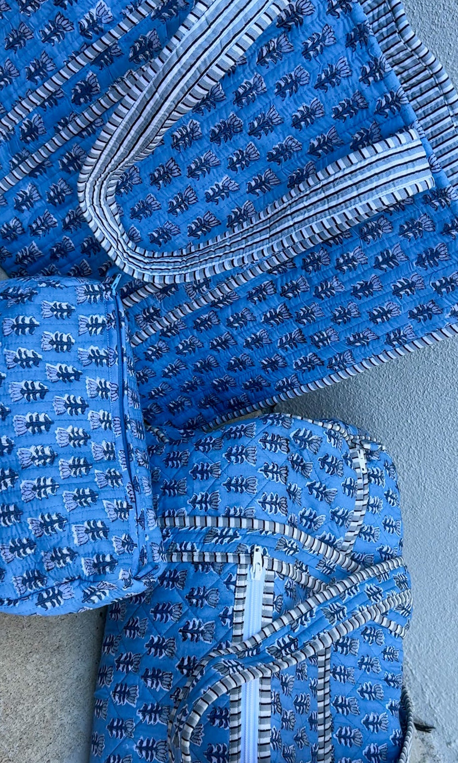 blue quilted block print duffle bag