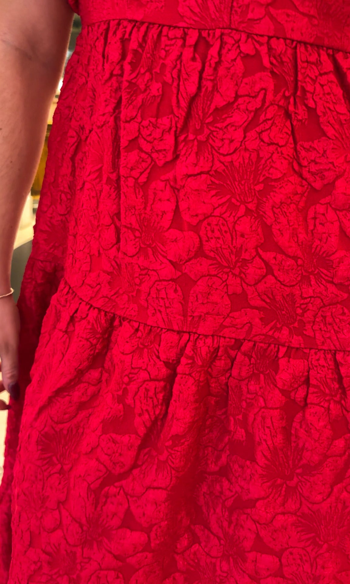 red jacquard maxi dress with puff sleeves and tiered skirt bottom and open back tie bow v neck holiday christmas dress