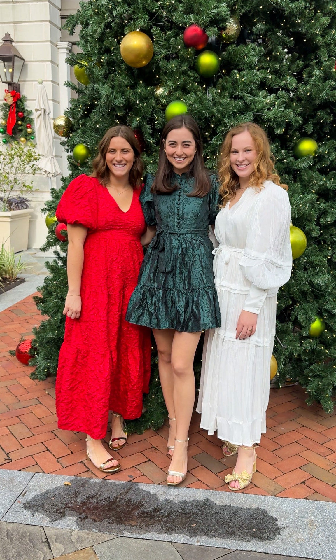 Shimmer crinkled long sleeve tiered midi dress with V-neckline, stand collar, waist tie belt, and flowing skirt.