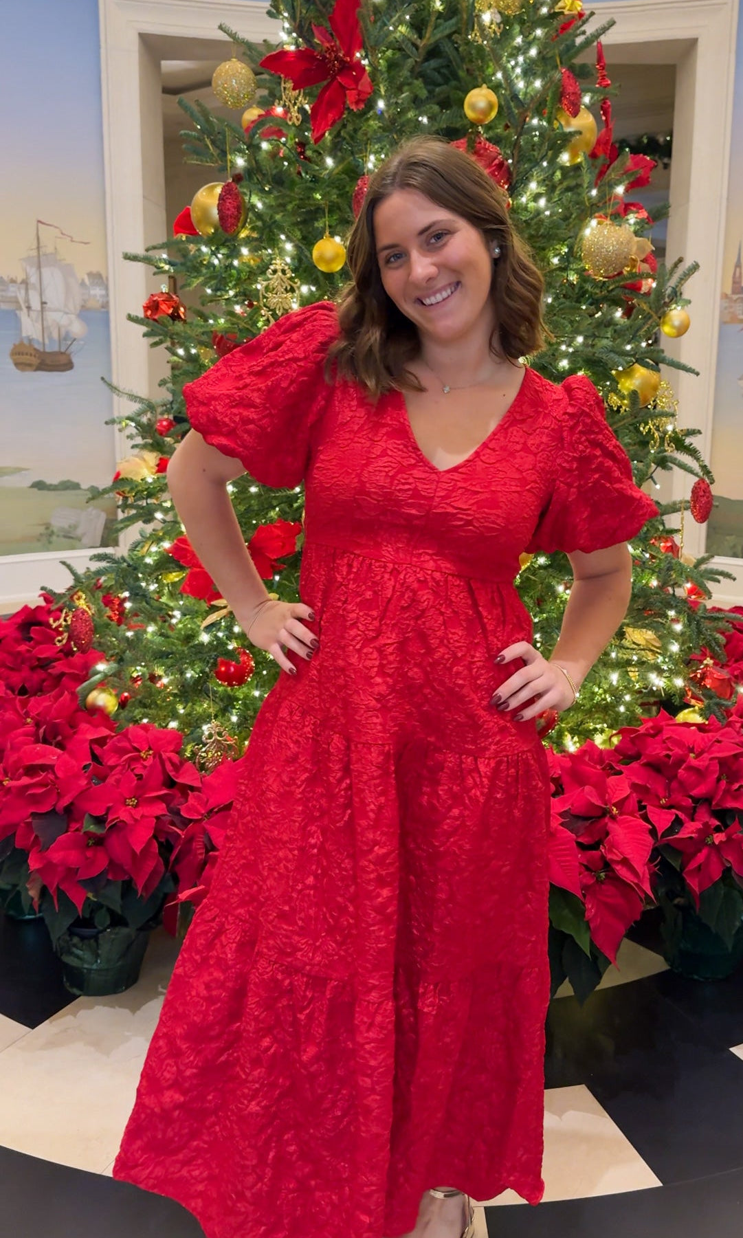 red jacquard maxi dress with puff sleeves and tiered skirt bottom and open back tie bow v neck holiday christmas dress