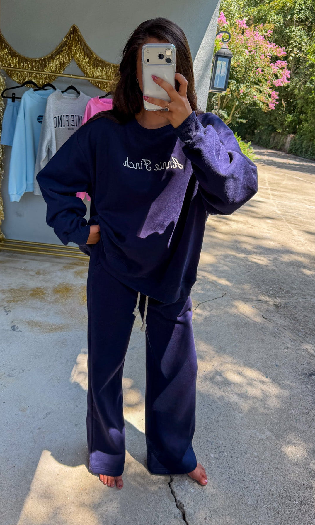 navy crewneck sweatshirt with white script "annie finch" embroidery with navy wideleg sweatpants