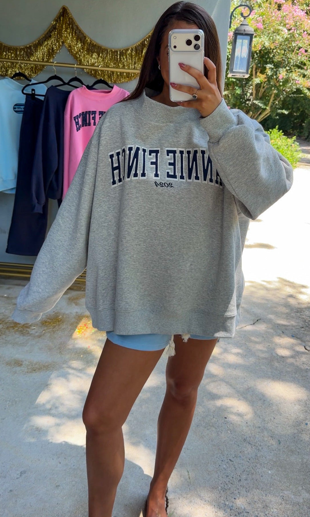 gray mockneck sweatshirt with navy embroidered "annie finch"