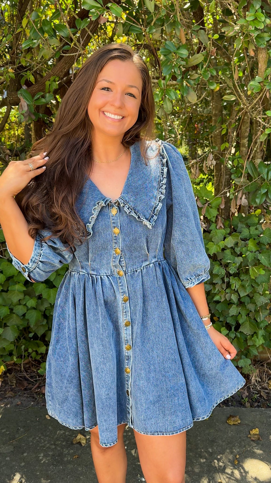 view of denim mini dress with oversized collar and 3/4 sleeves