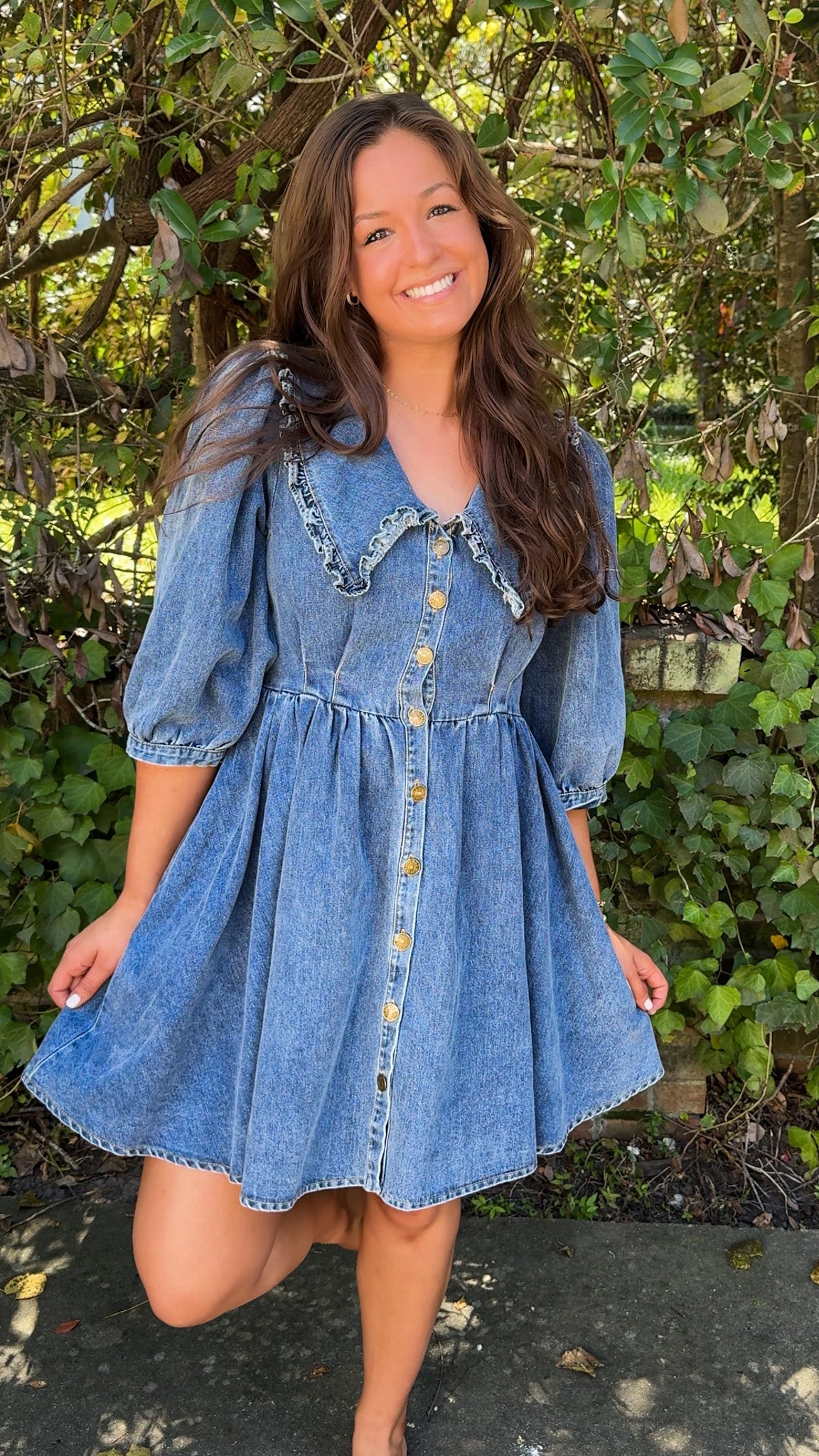 front view of denim mini dress with oversized collar and 3/4 sleeves