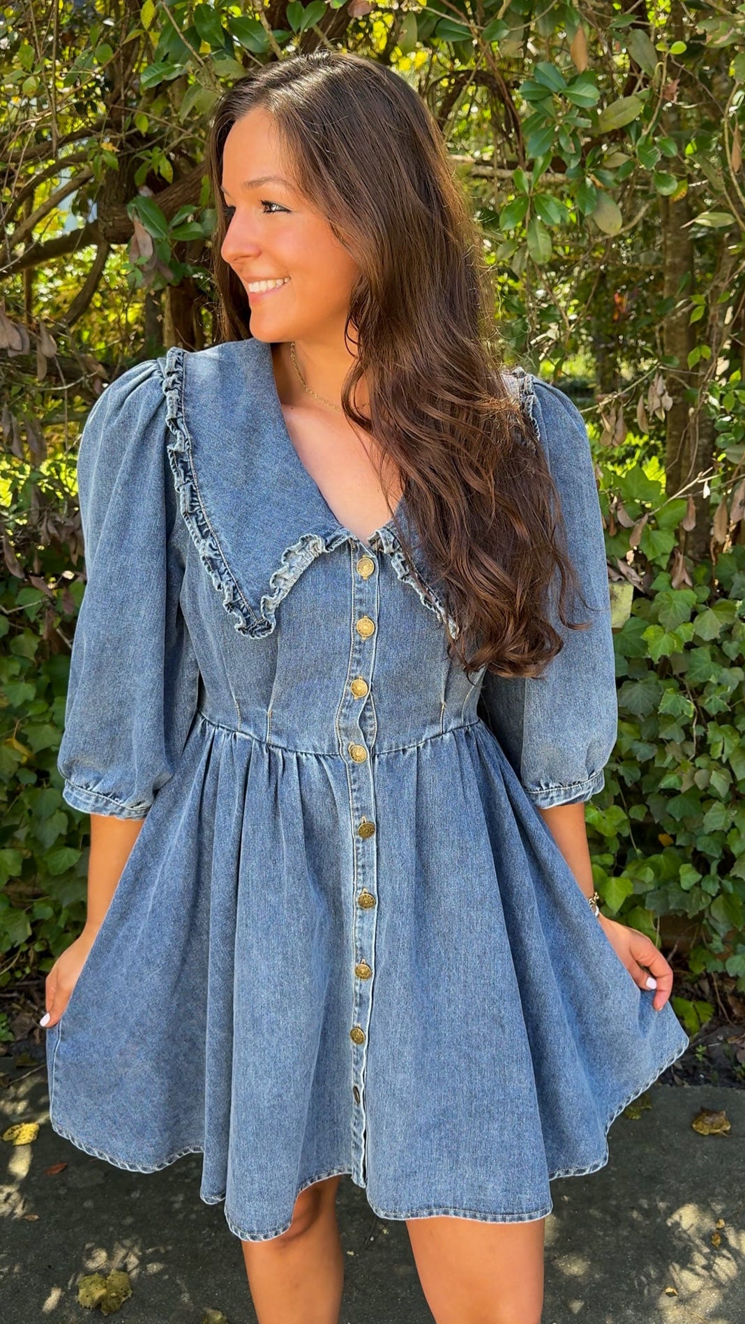 close view of denim mini dress with oversized collar and 3/4 sleeves