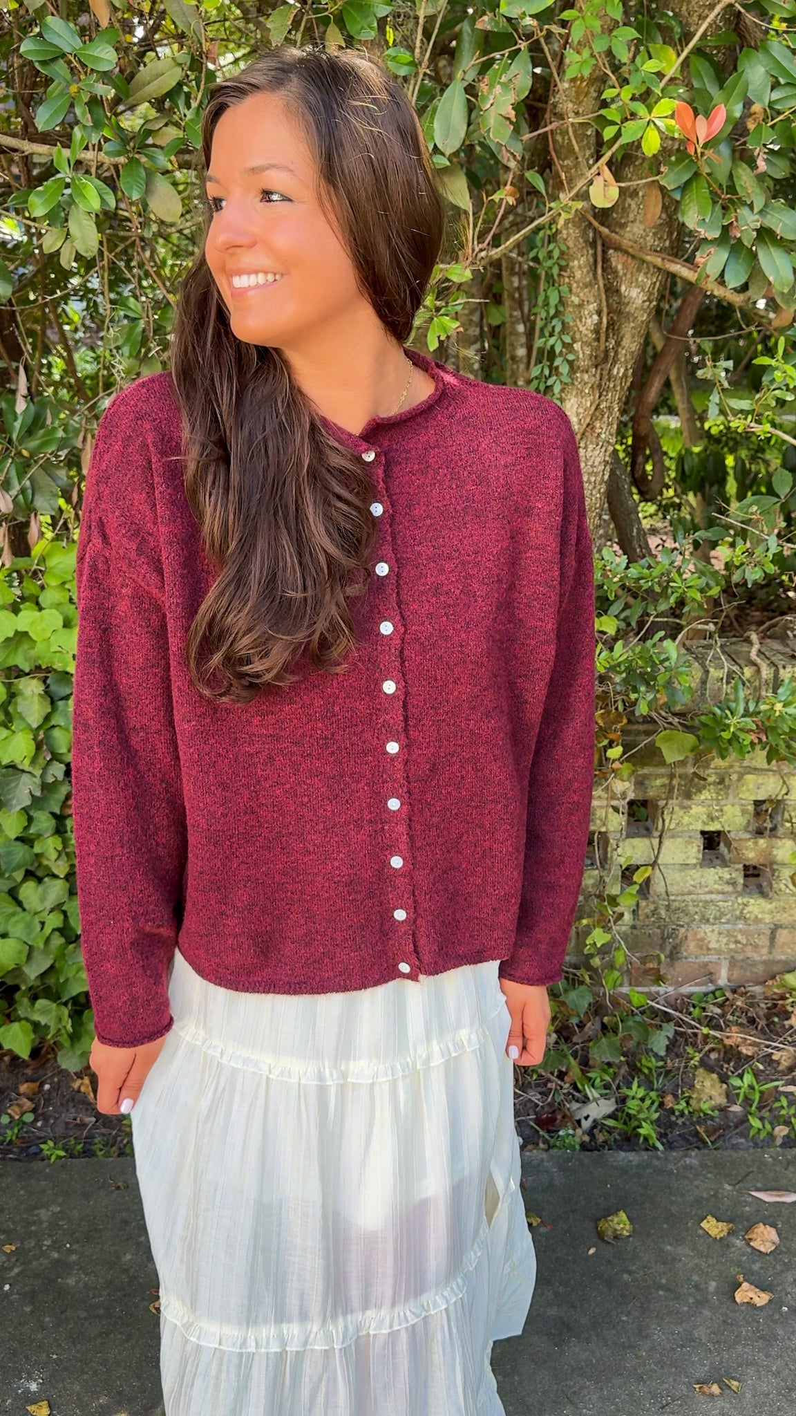 front view of burgundy maroon cardigan and white flowy midi skirt 2