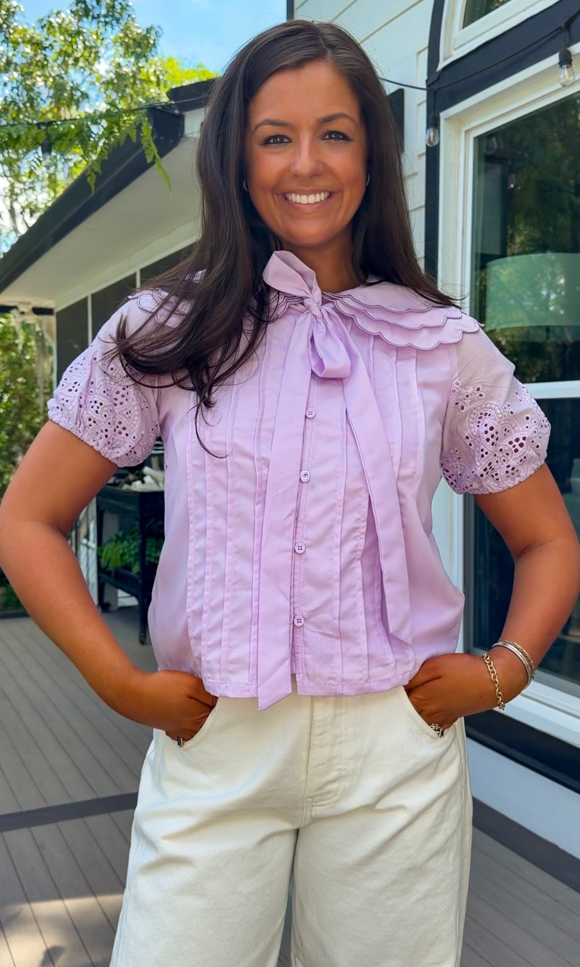 lilac top with eyelet puff sleeves and oversized collar button down closure