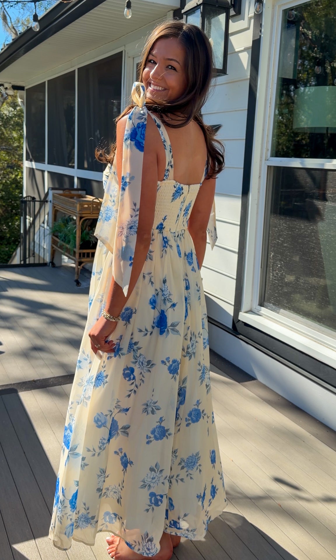 women's floral blue cream midi dress with smocked detailing and tie straps flowy