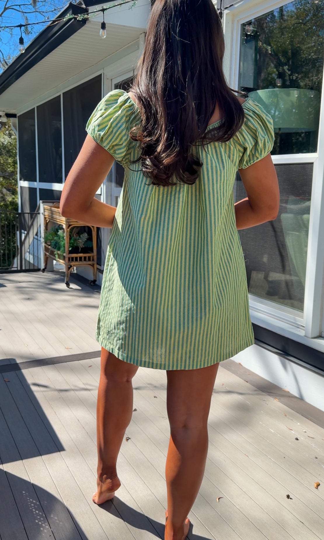 green striped babydoll mini dress with gathered neckline and pockets