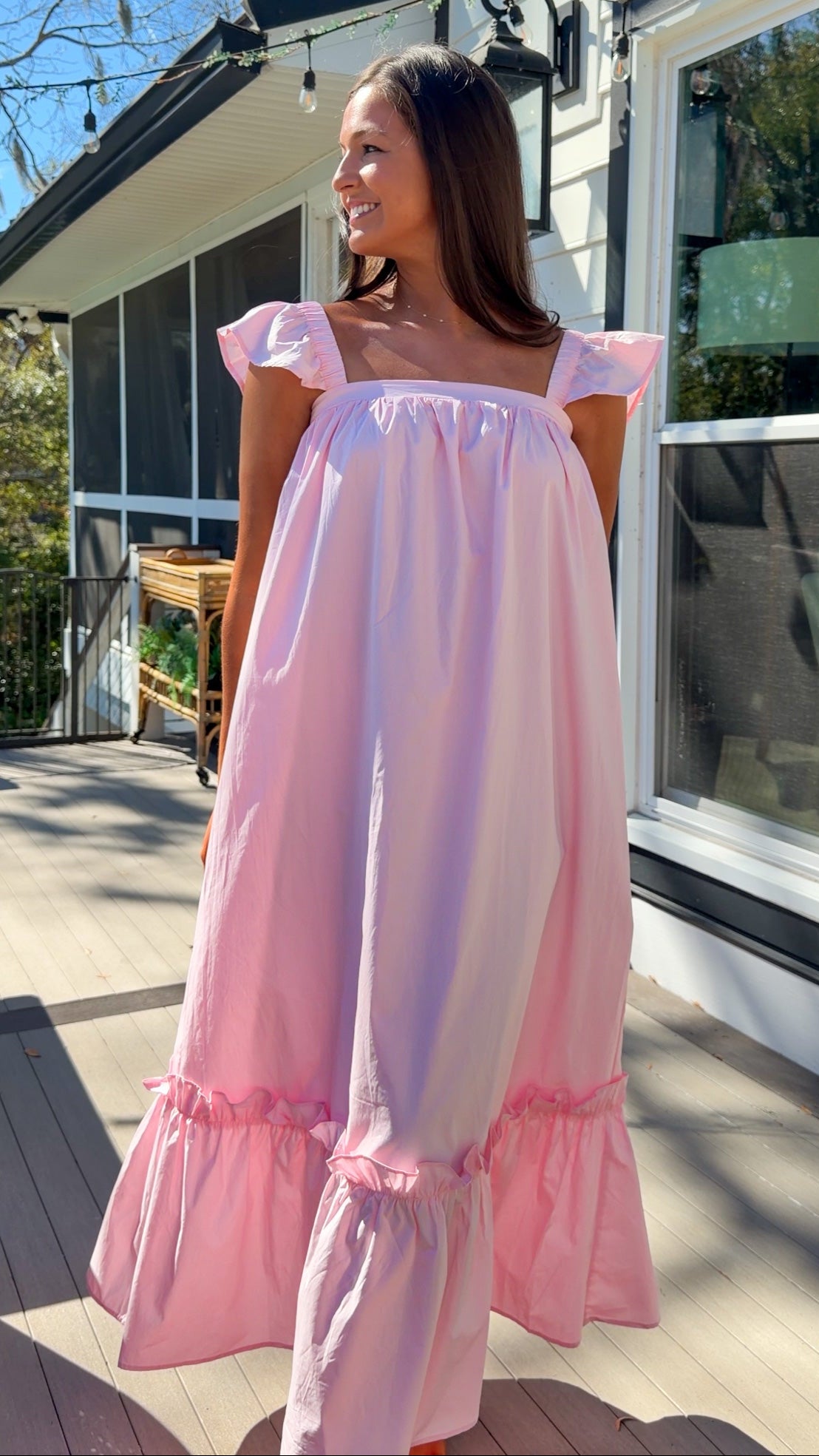 baby pink midi dress with flutter sleeves and tiered ruffle hem