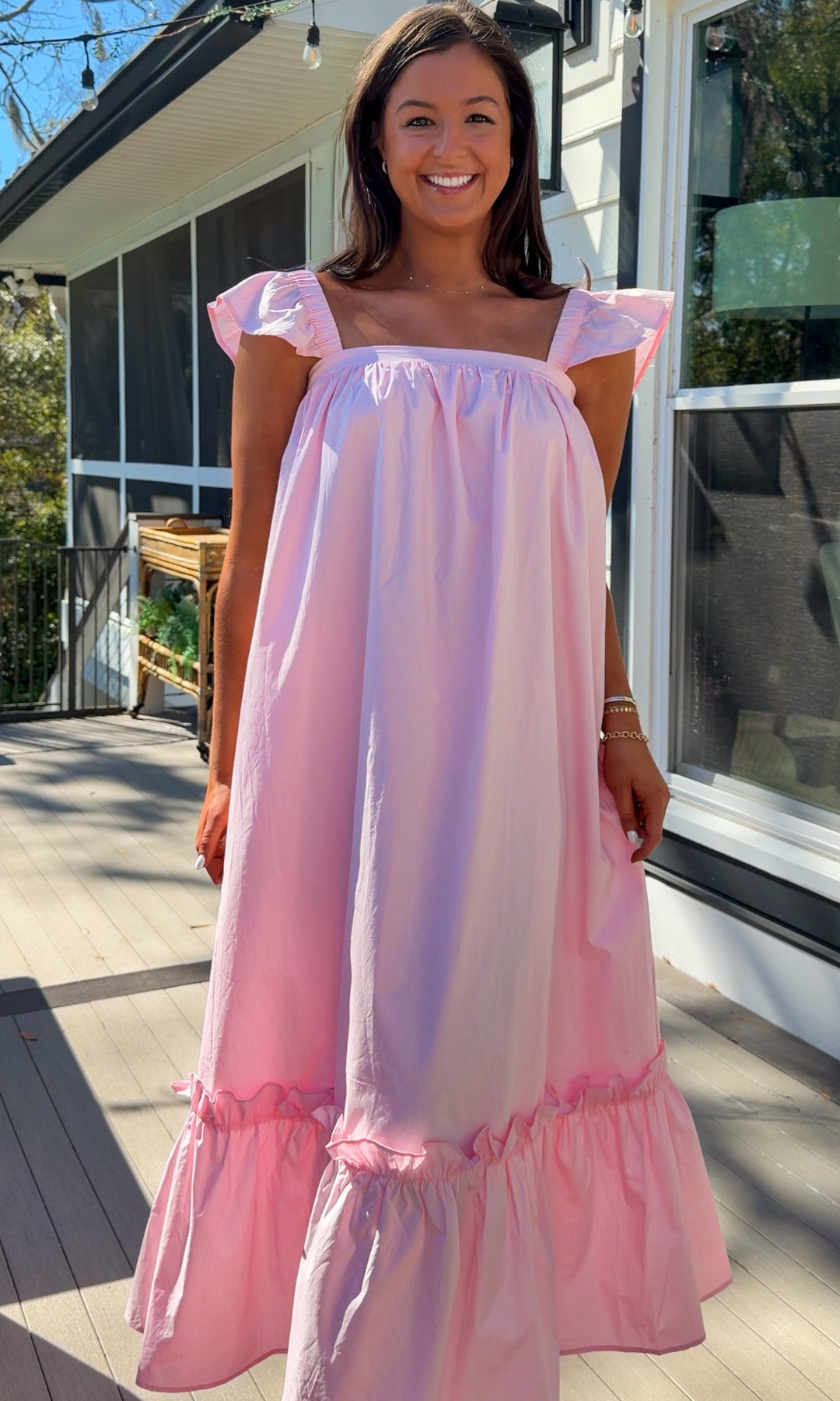 baby pink midi dress with flutter sleeves and tiered ruffle hem