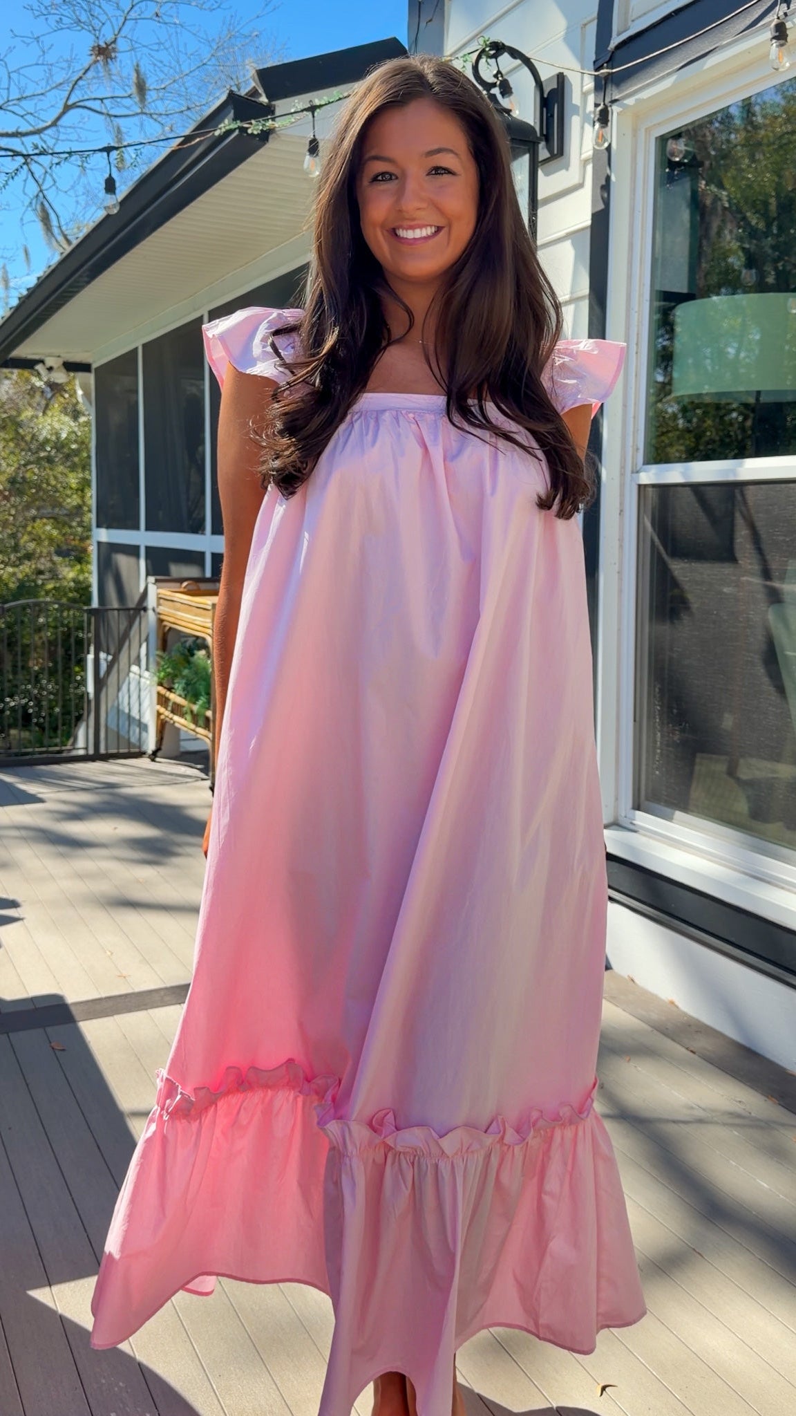 baby pink midi dress with flutter sleeves and tiered ruffle hem