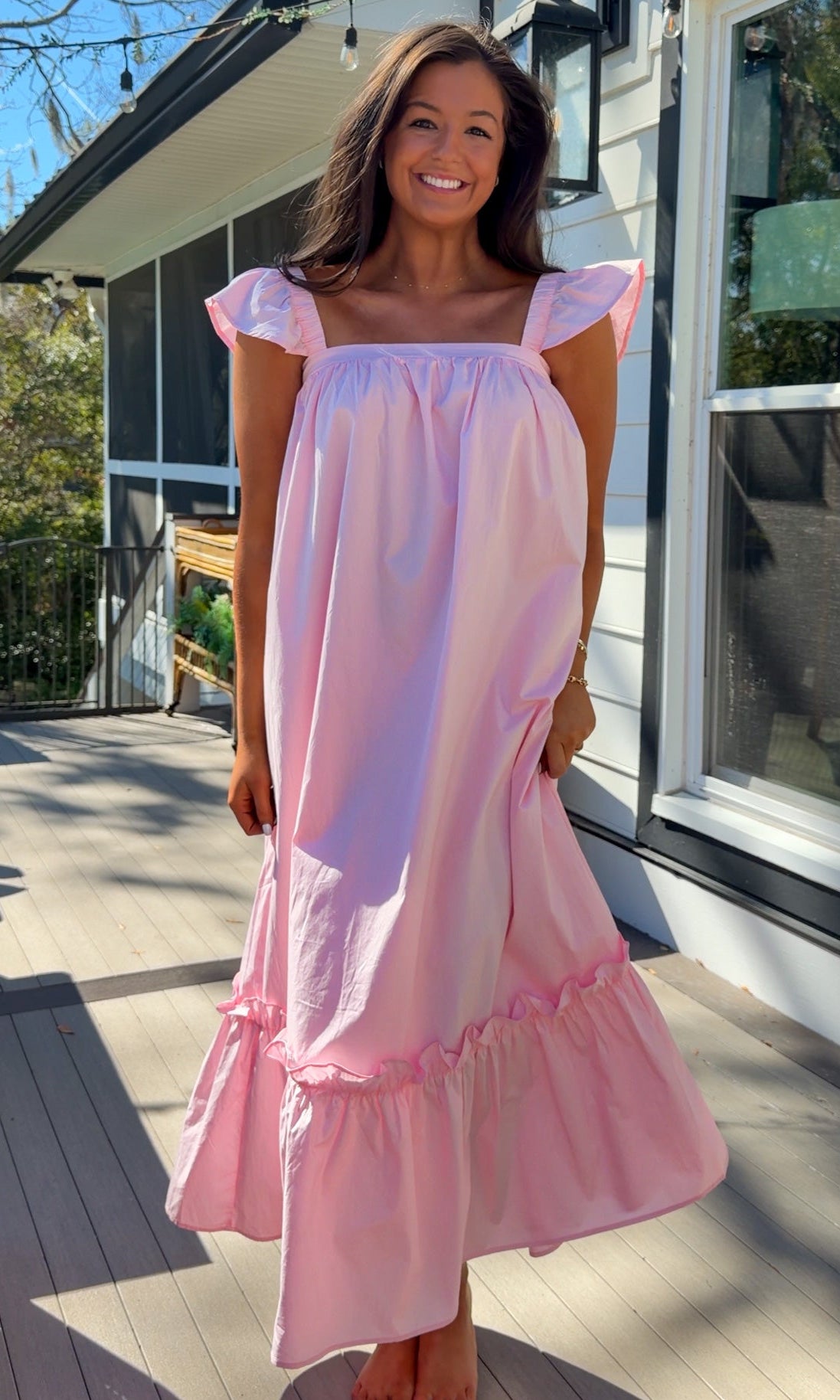 baby pink midi dress with flutter sleeves and tiered ruffle hem