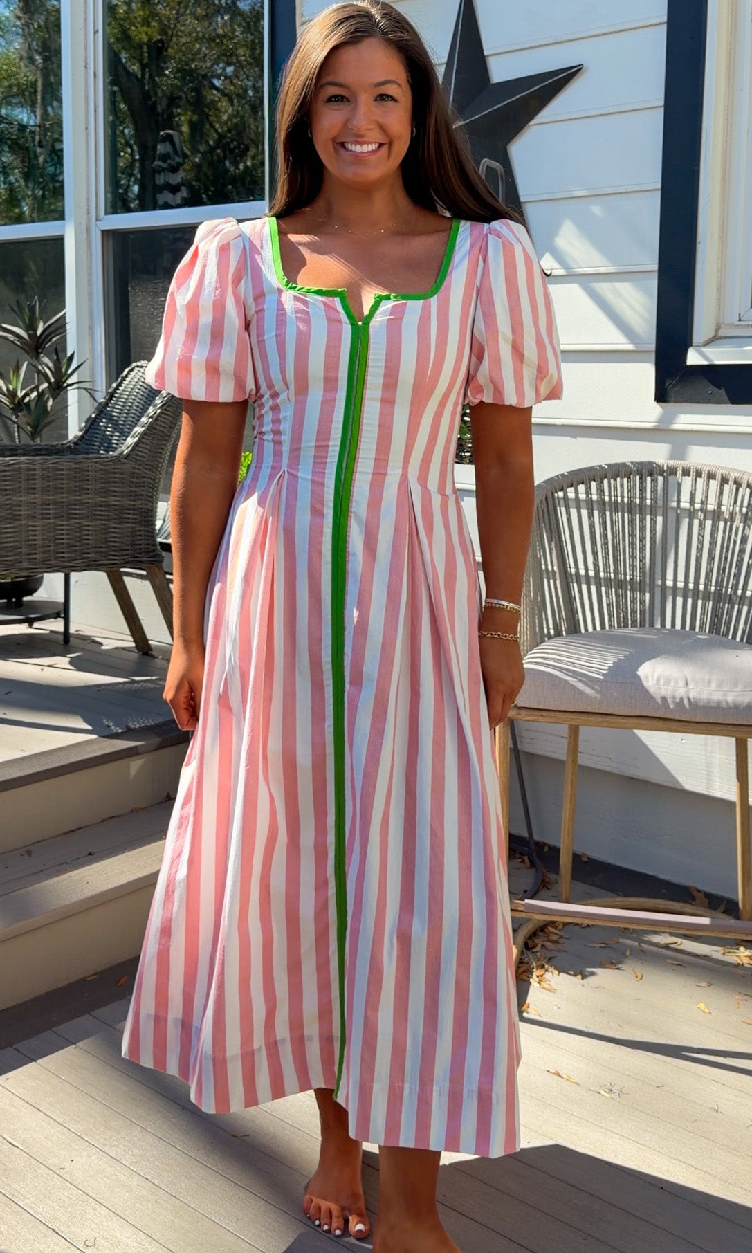 pink striped midi dress with green contrast trim and puff sleeves