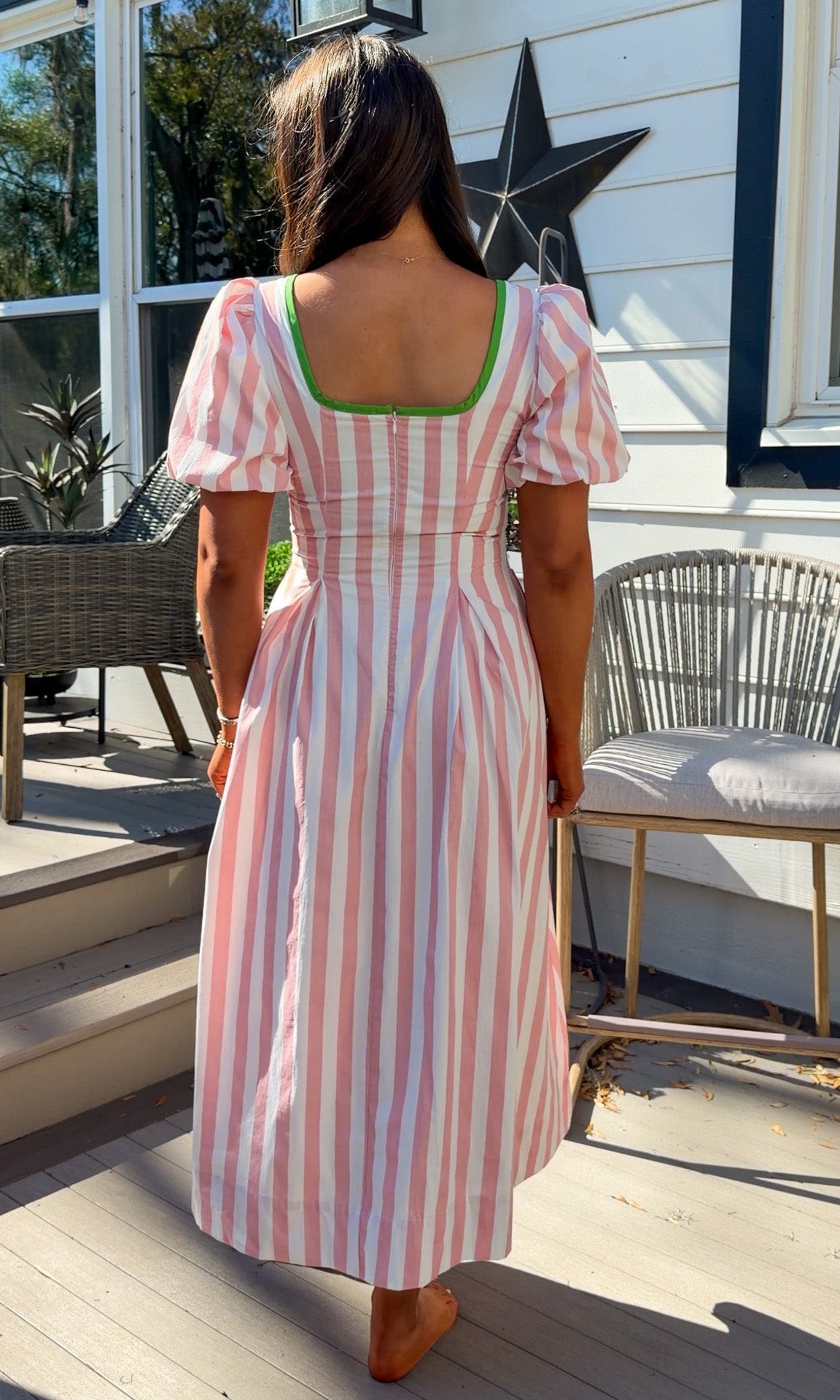 pink striped midi dress with green contrast trim and puff sleeves